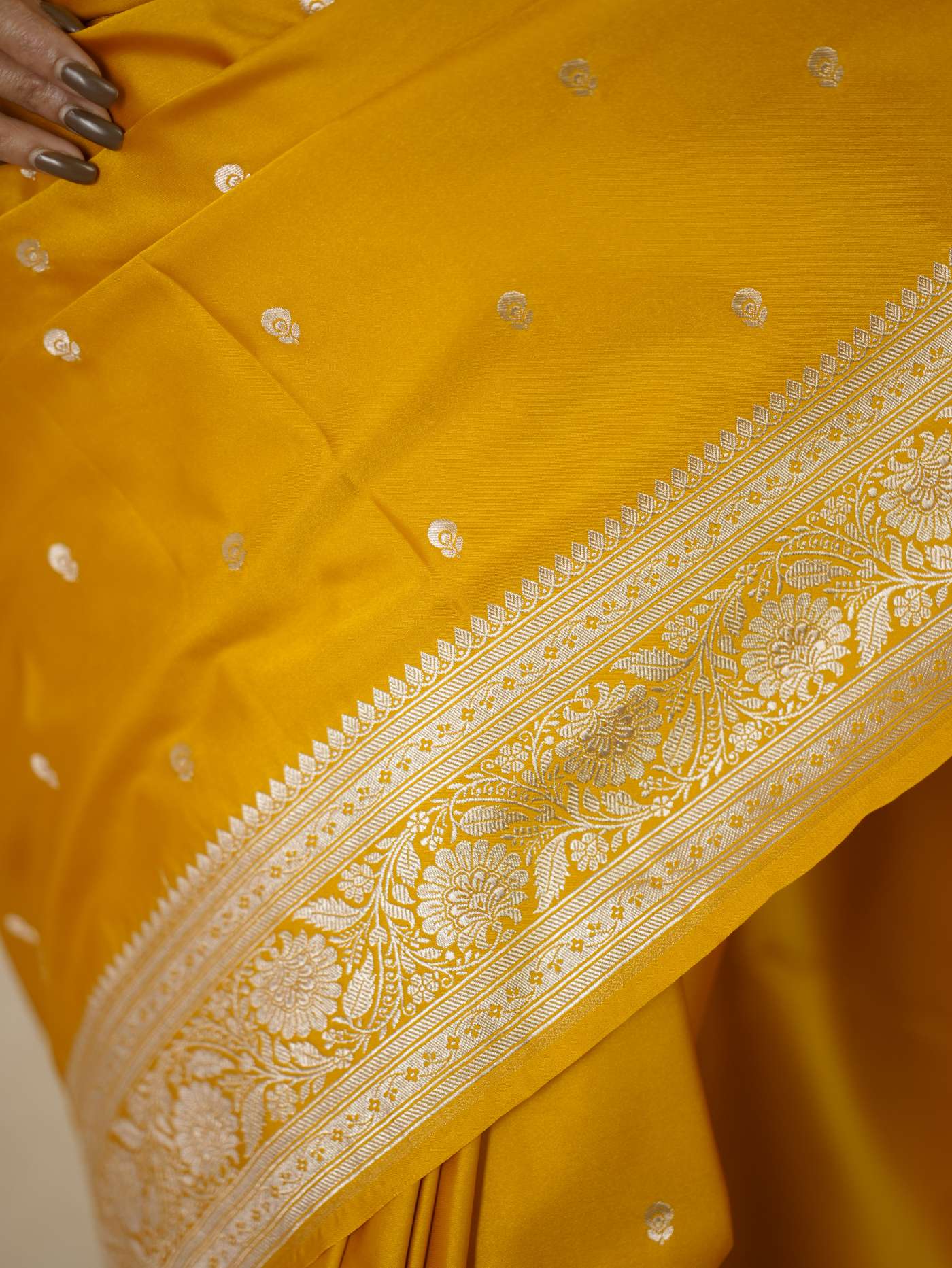 Yellow semi-Benarasi silk saree with intricate designs and matching 1-meter blouse piece from Joyee Kolkata.