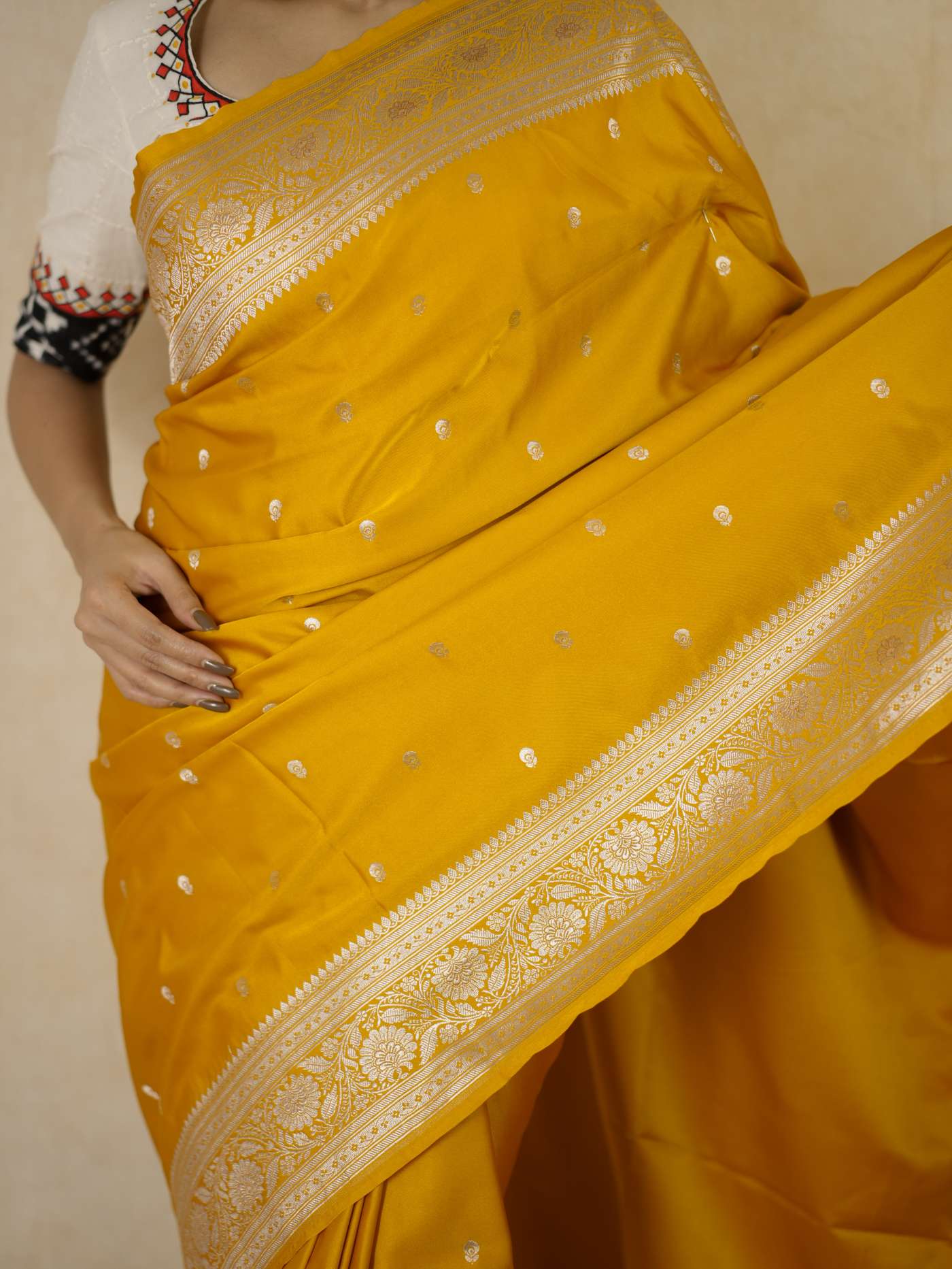 Yellow semi Benarasi silk saree with intricate patterns and a matching 1-meter blouse piece from Joyee Kolkata.
