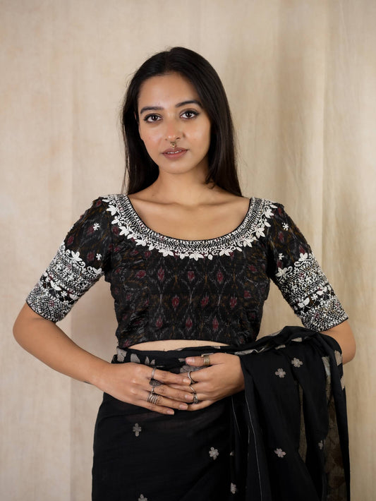 JoyeeKolkata SUDHA variable product with colorful fabric and intricate embroidery, showcasing detailed craftsmanship.