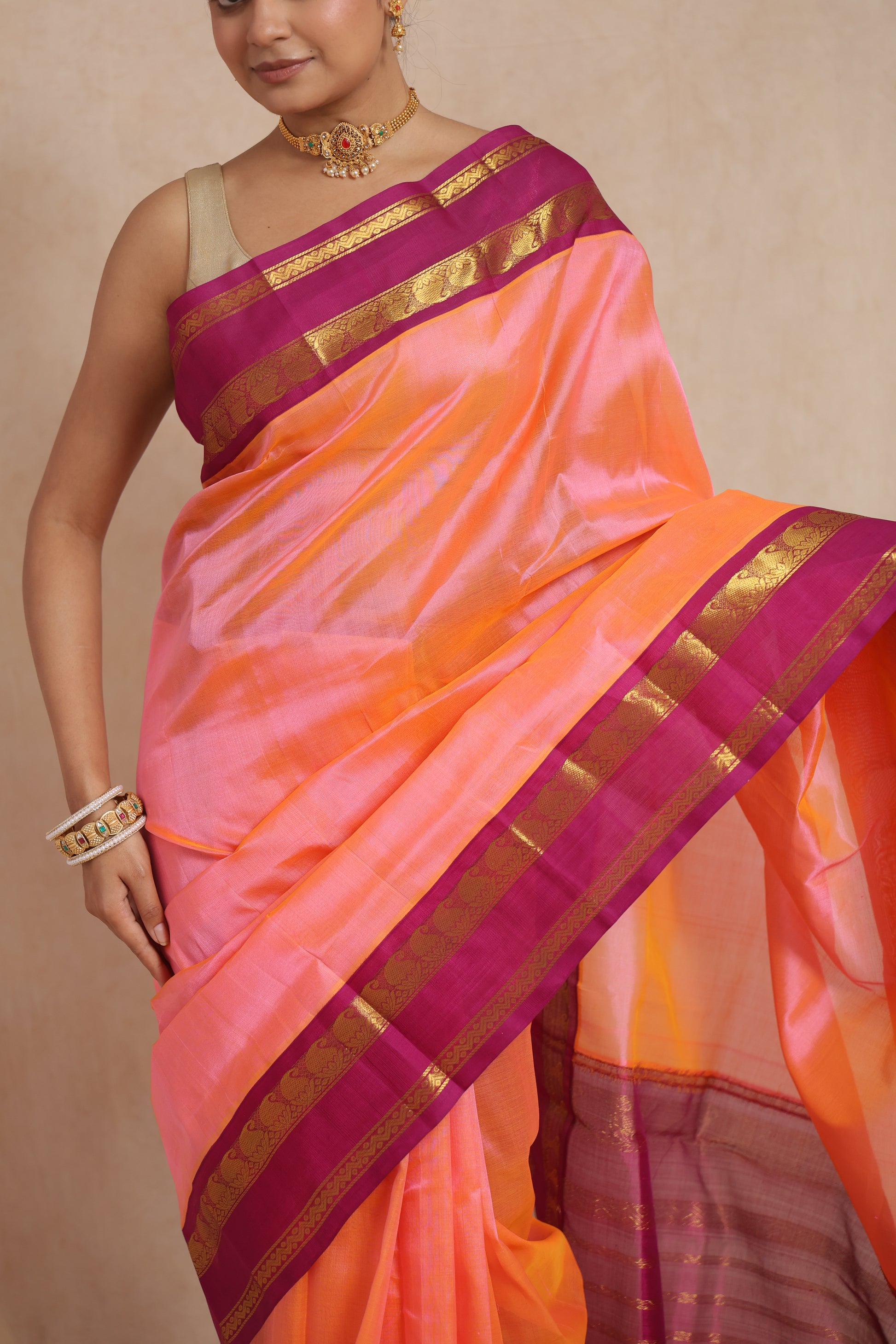 Detailed black zari woven pallu of pink Kanchipuram silk cotton saree
