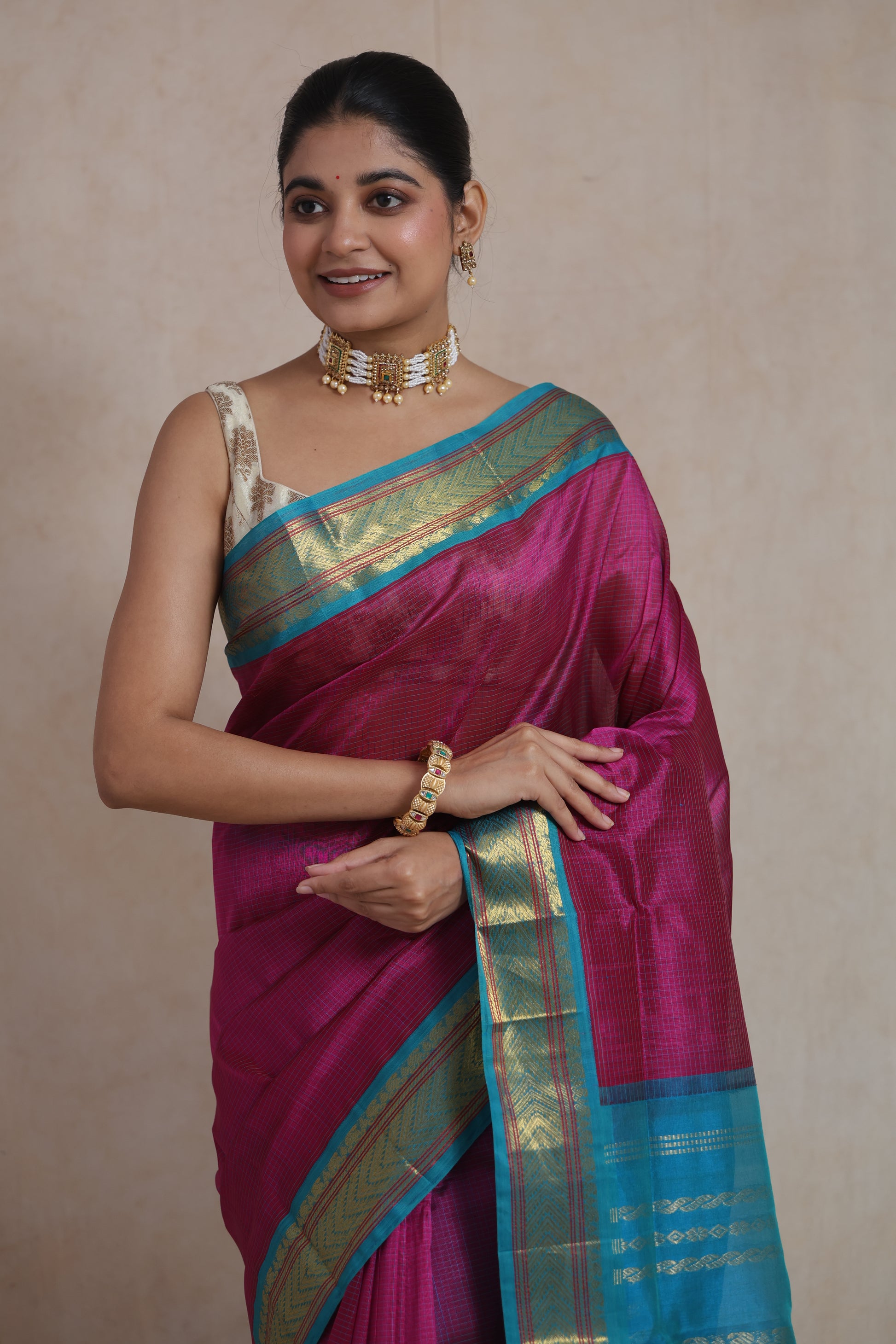 Elegant magenta Kanchipuram silk cotton saree with woven aqua blue border
