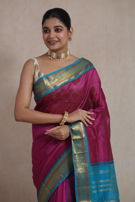 Elegant magenta Kanchipuram silk cotton saree with woven aqua blue border