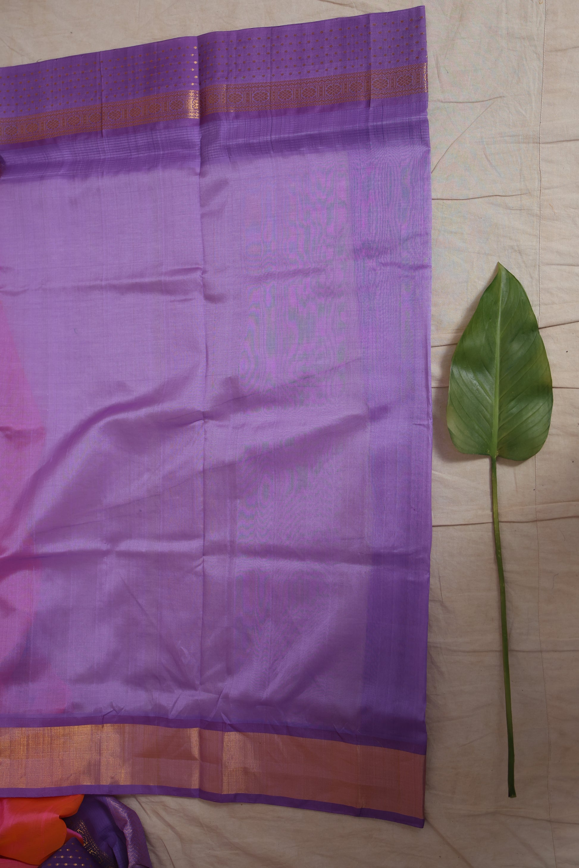 Detailed zari weave of coral pink Kanchipuram silk cotton saree