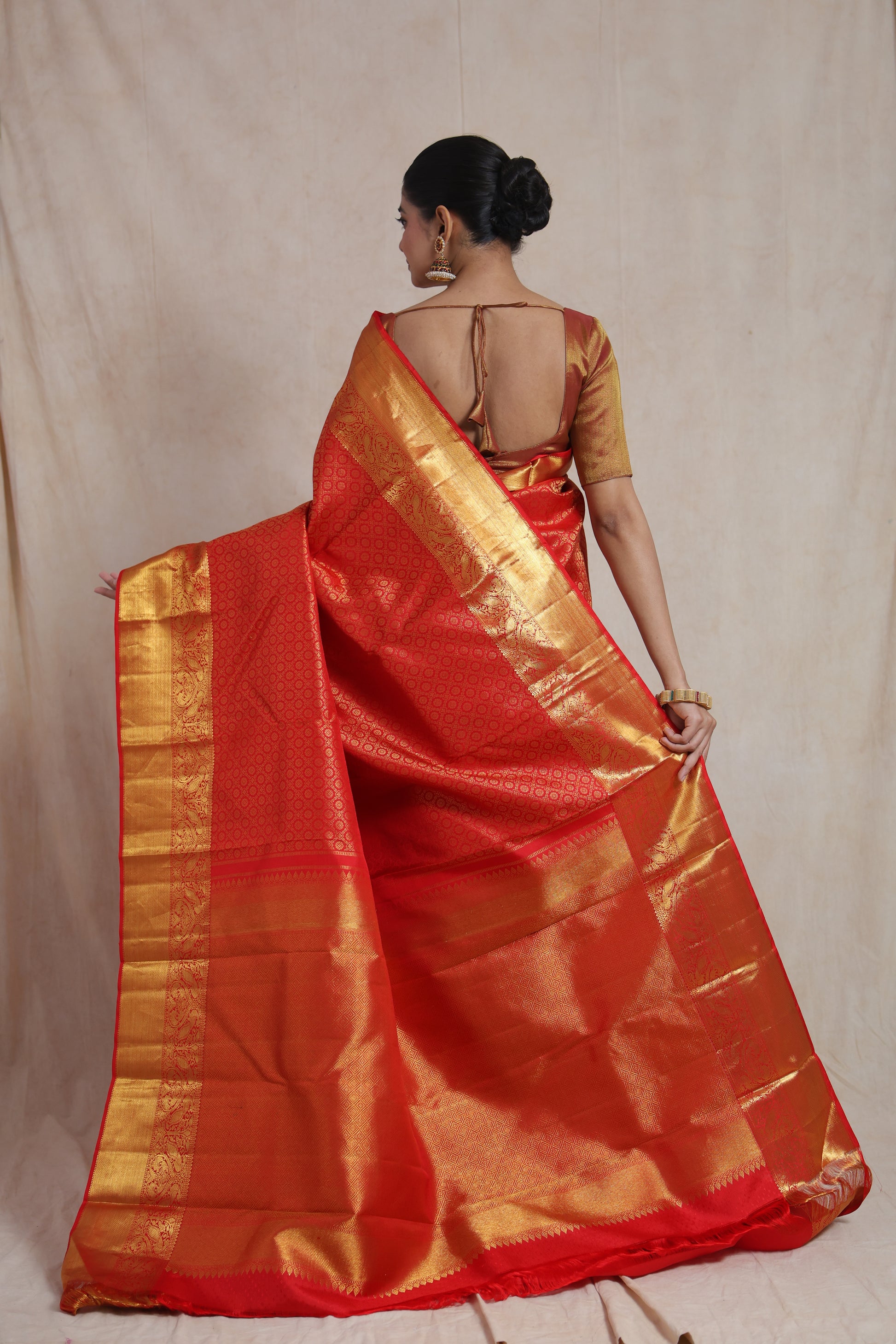 Back view showcasing grand zari pallu of silk saree