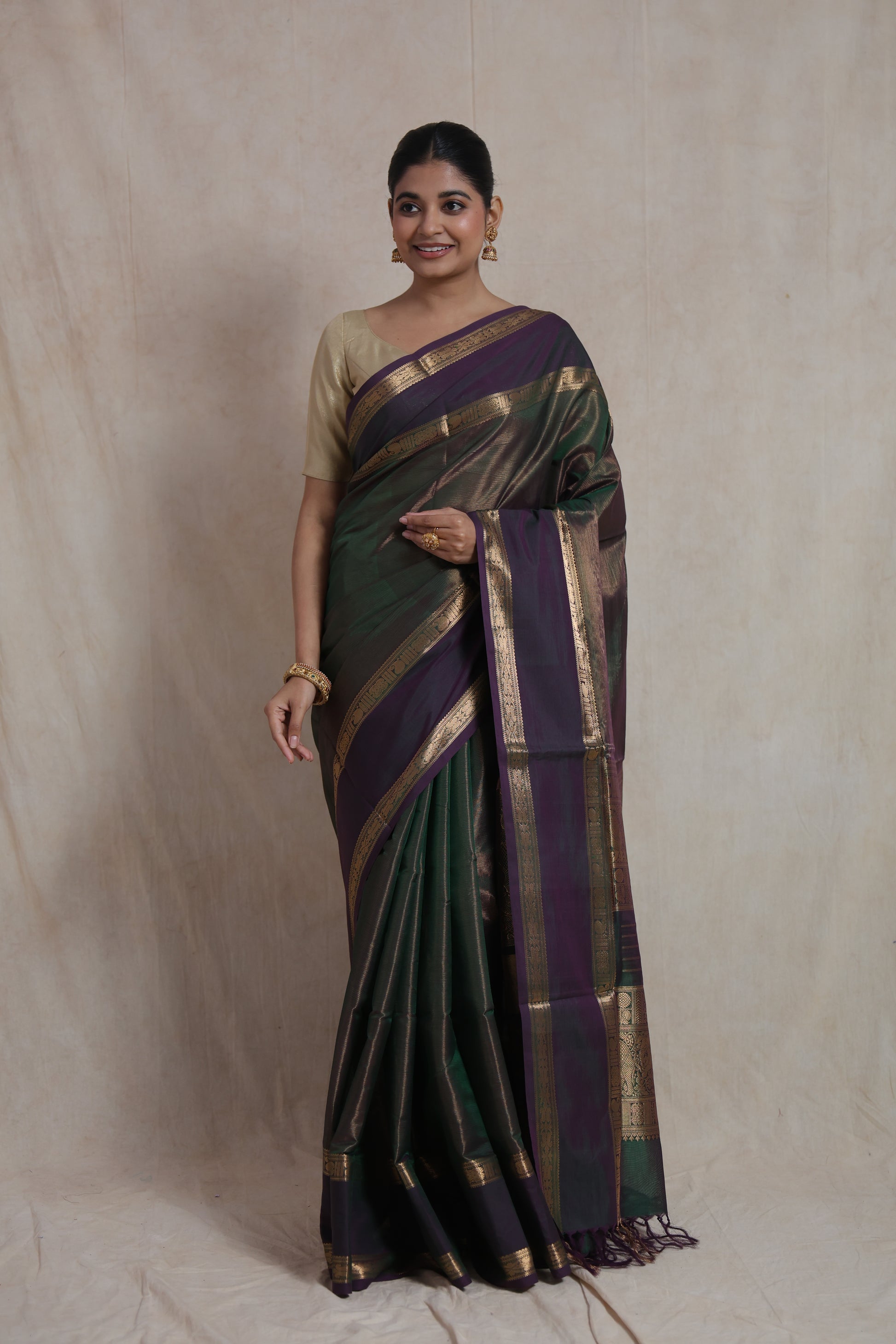 Elegant drape view of dual-tone Kanchipuram silk saree with rich zari border