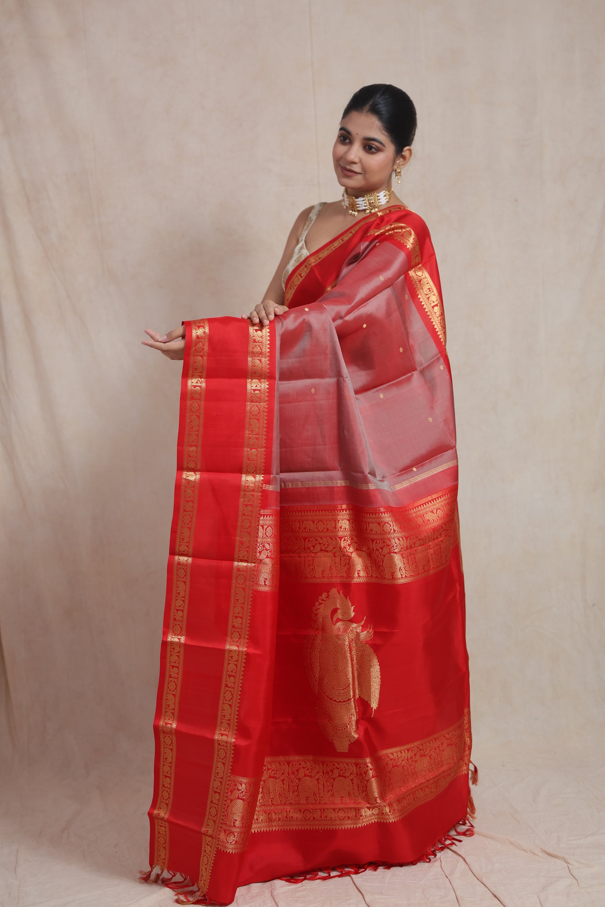 Closeup model shot wearing royal red Kanchiwaram silk saree