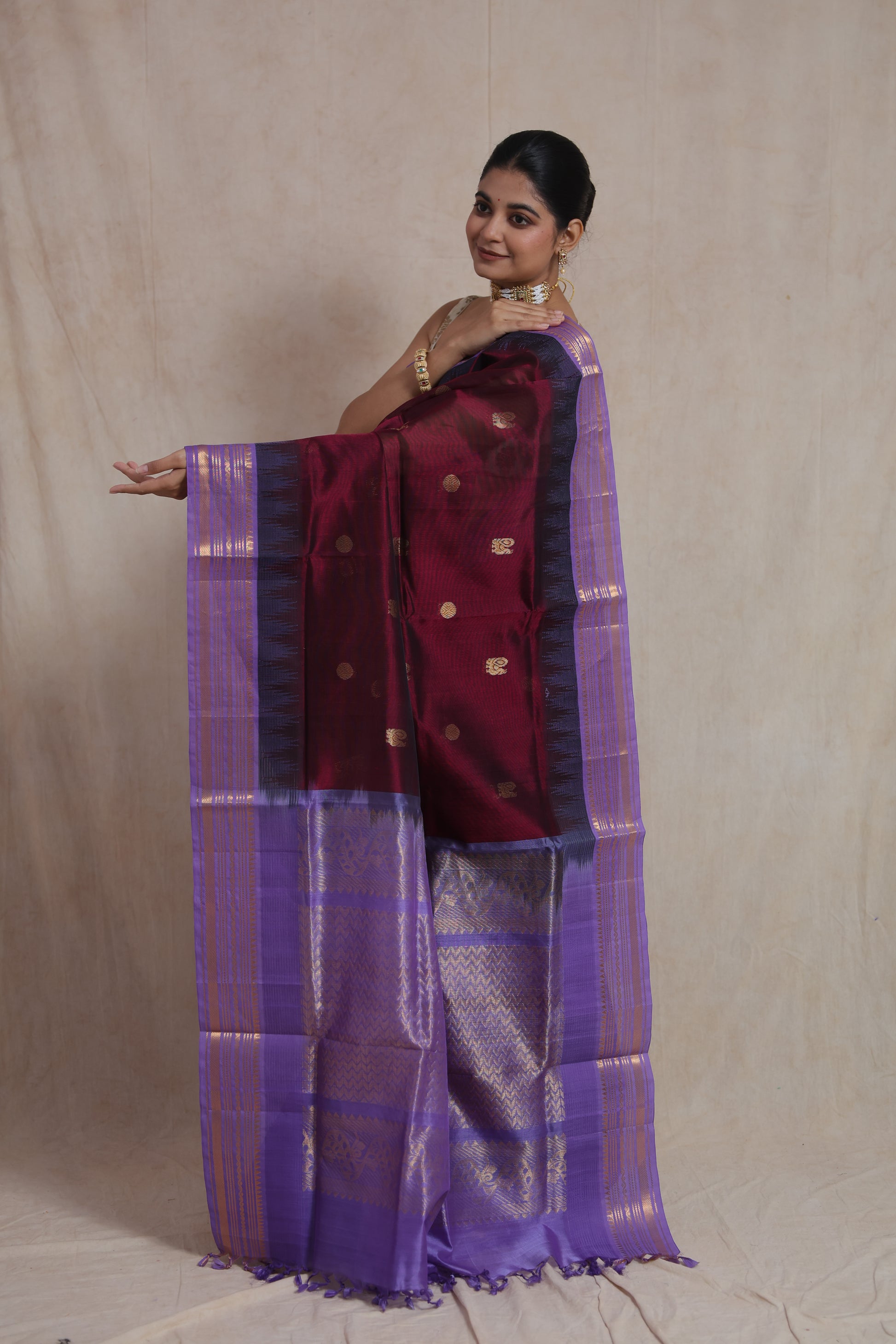 Kanjipuram silk cotton saree with woven lavender zari pallu and golden buttas