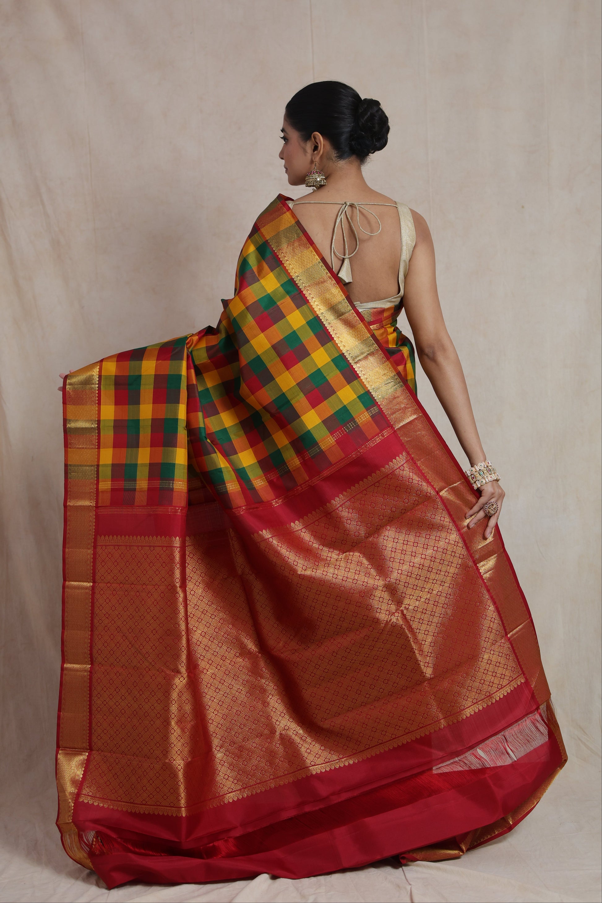 Back view showcasing the richly woven crimson red pallu of a Kanjivaram pure silk saree