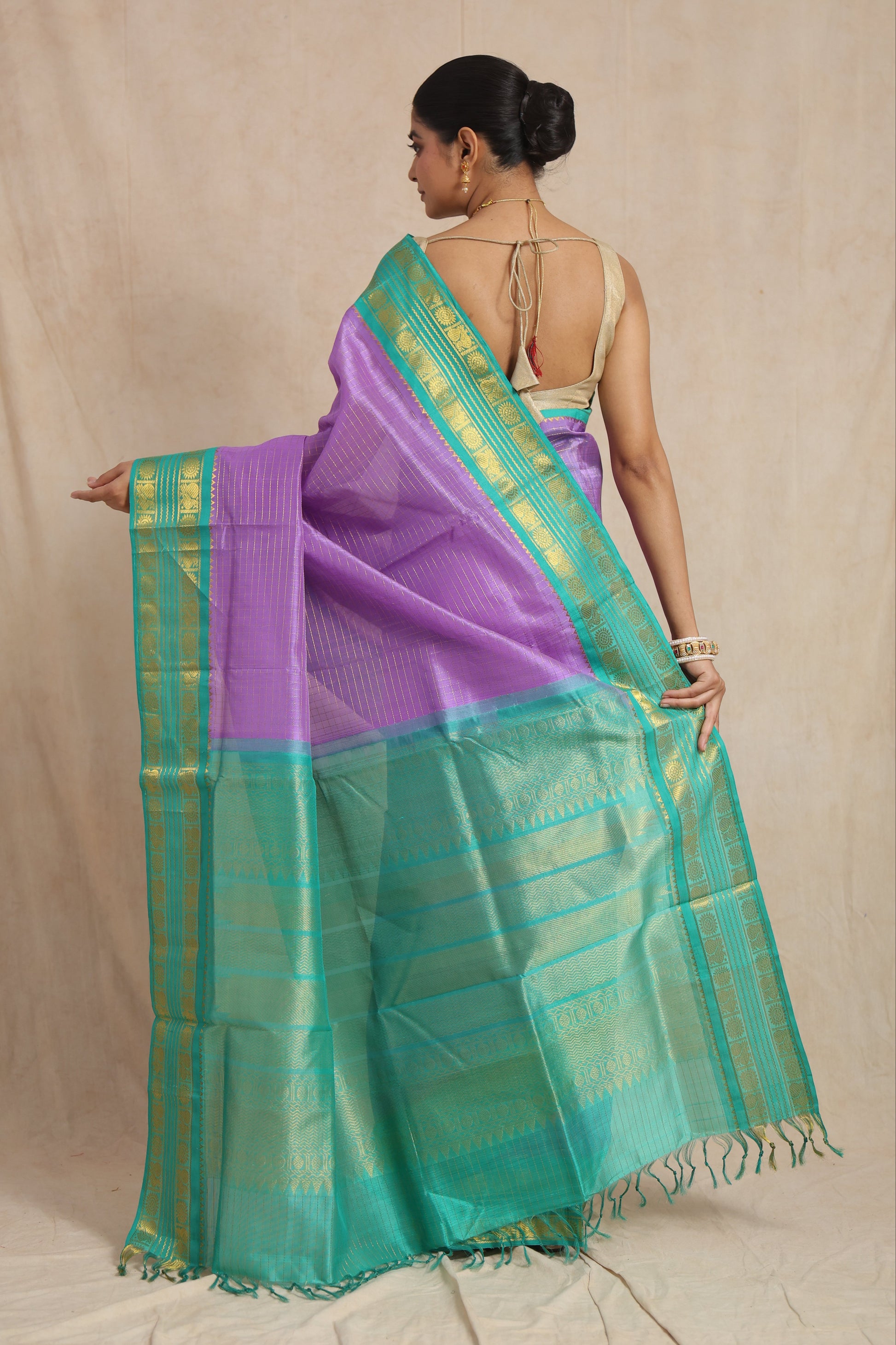 Back drape view of lavender Kanchipuram Sico saree with rich aqua pallu