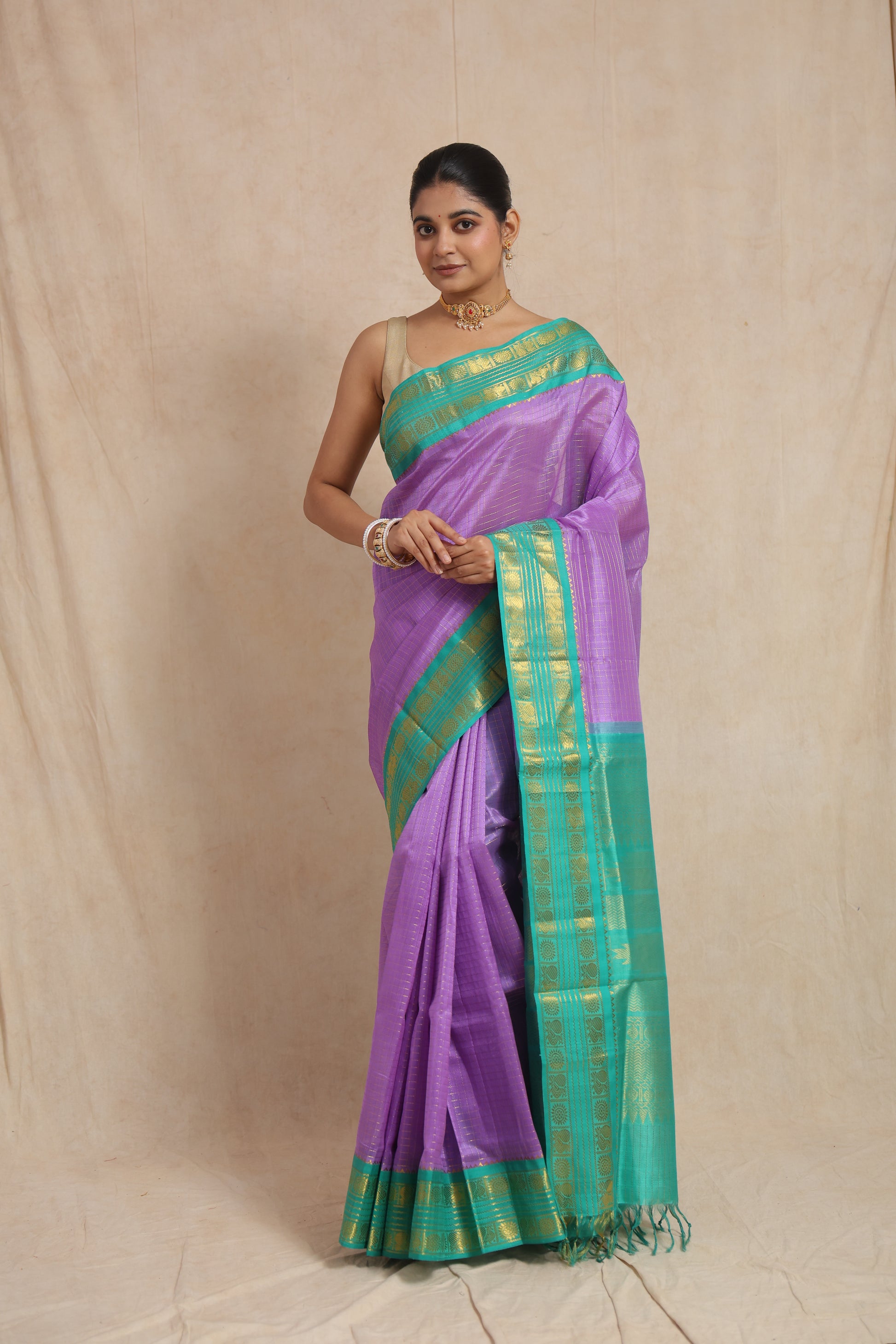 Full view of lavender Kanchipuram Sico saree with aqua green woven border