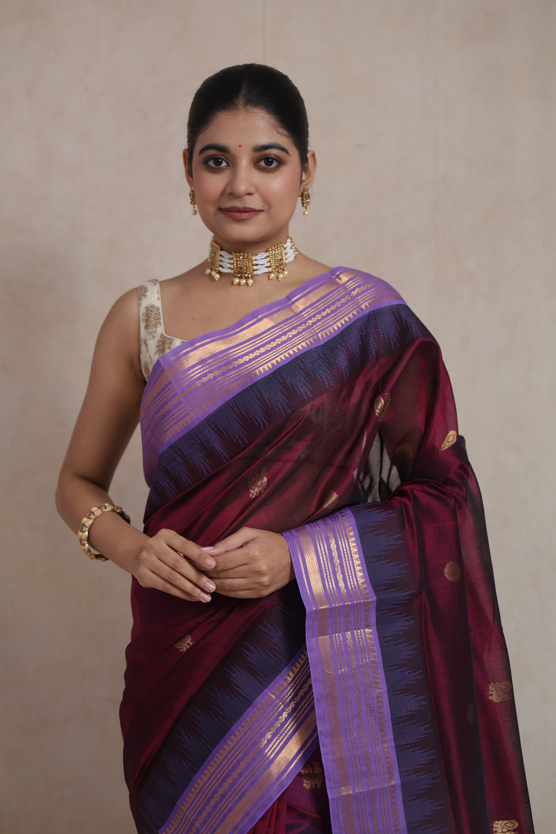 Lavender zari border detail on wine purple Kanjipuram silk cotton saree