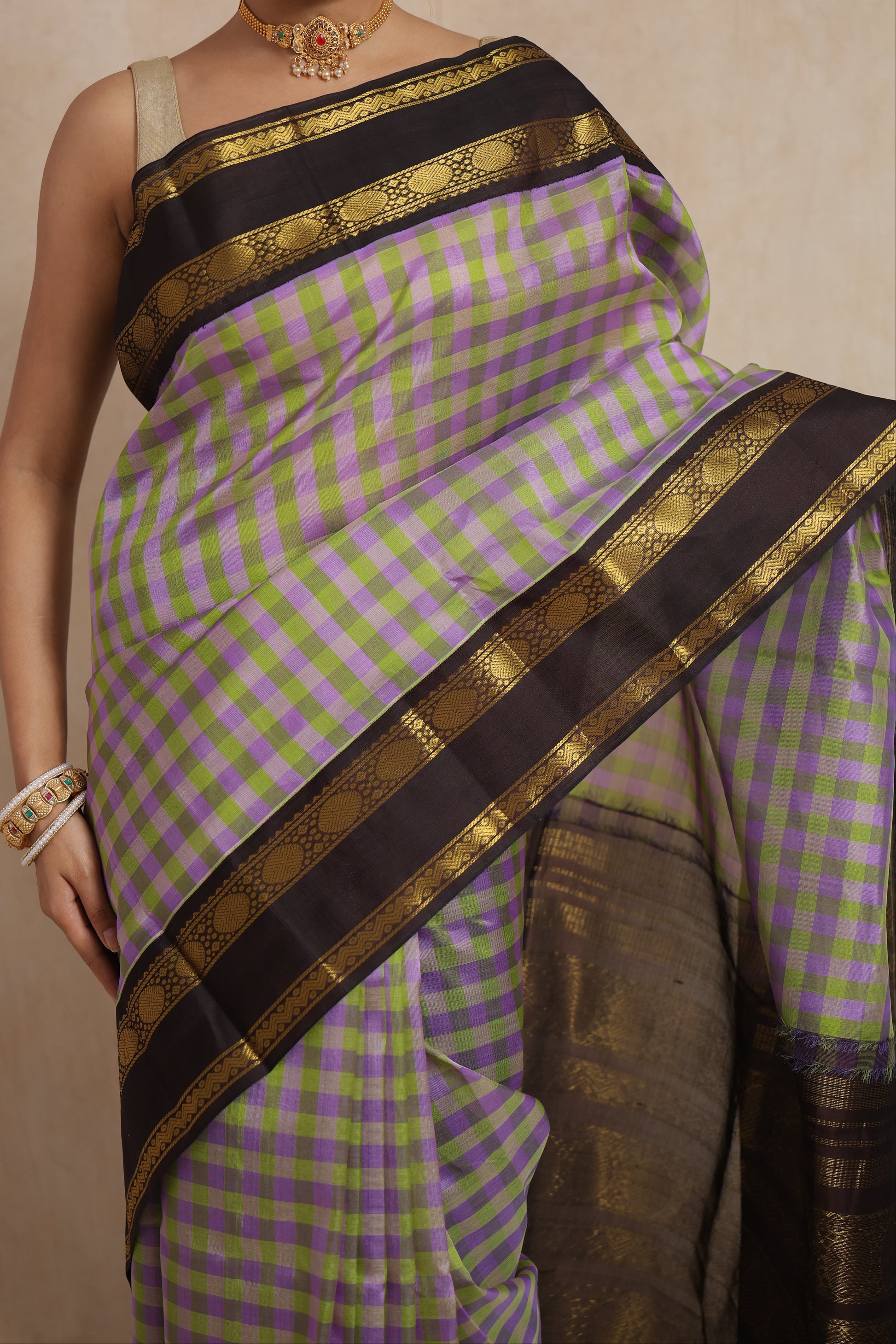 Close-up of lavender and olive checked Kanchipuram Sico saree with black zari border