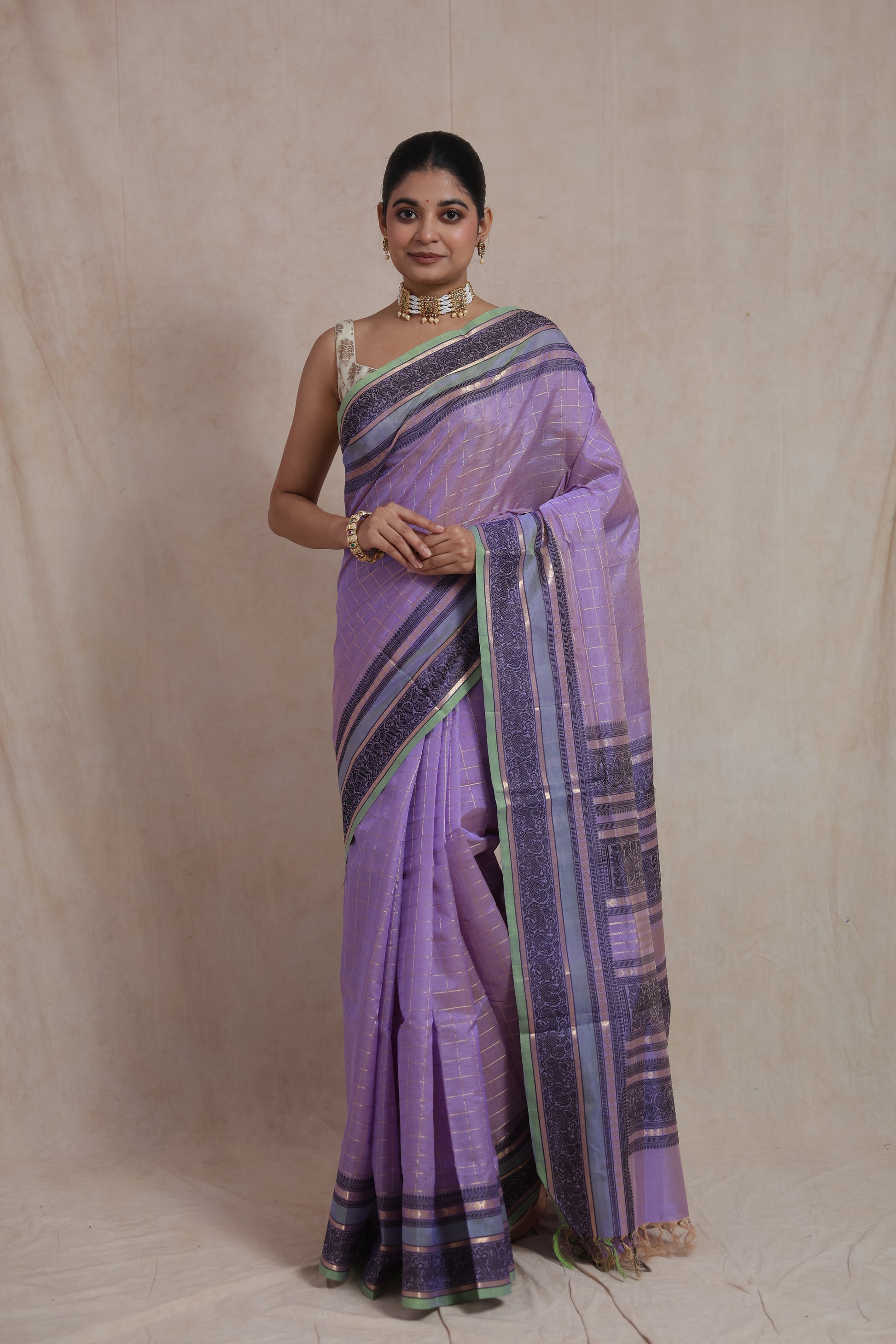 Full view of lavender Kanchipuram silk cotton saree with traditional border