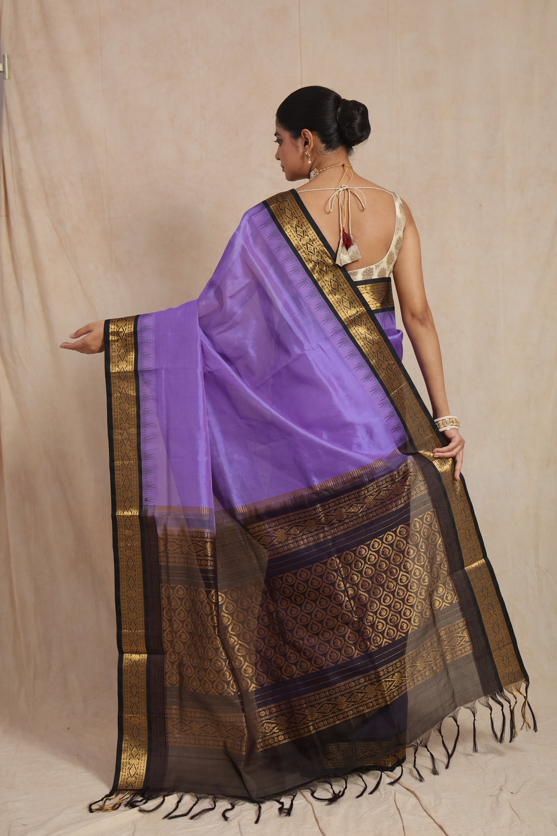 Back drape view of lavender purple Kanchipuram Sico saree with rich pallu