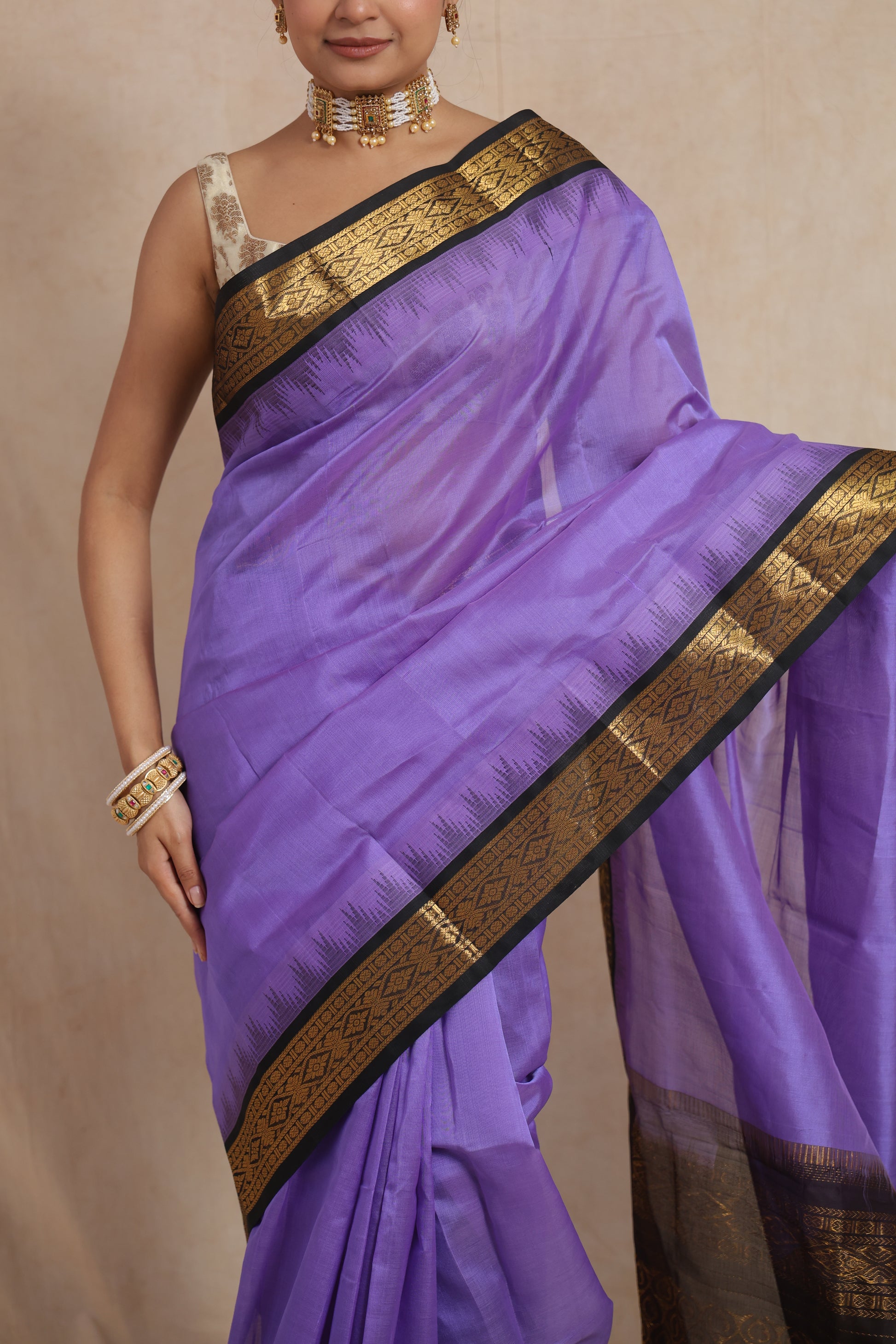 Elegant drape view of lavender purple Kanchipuram Sico saree with contrast black border