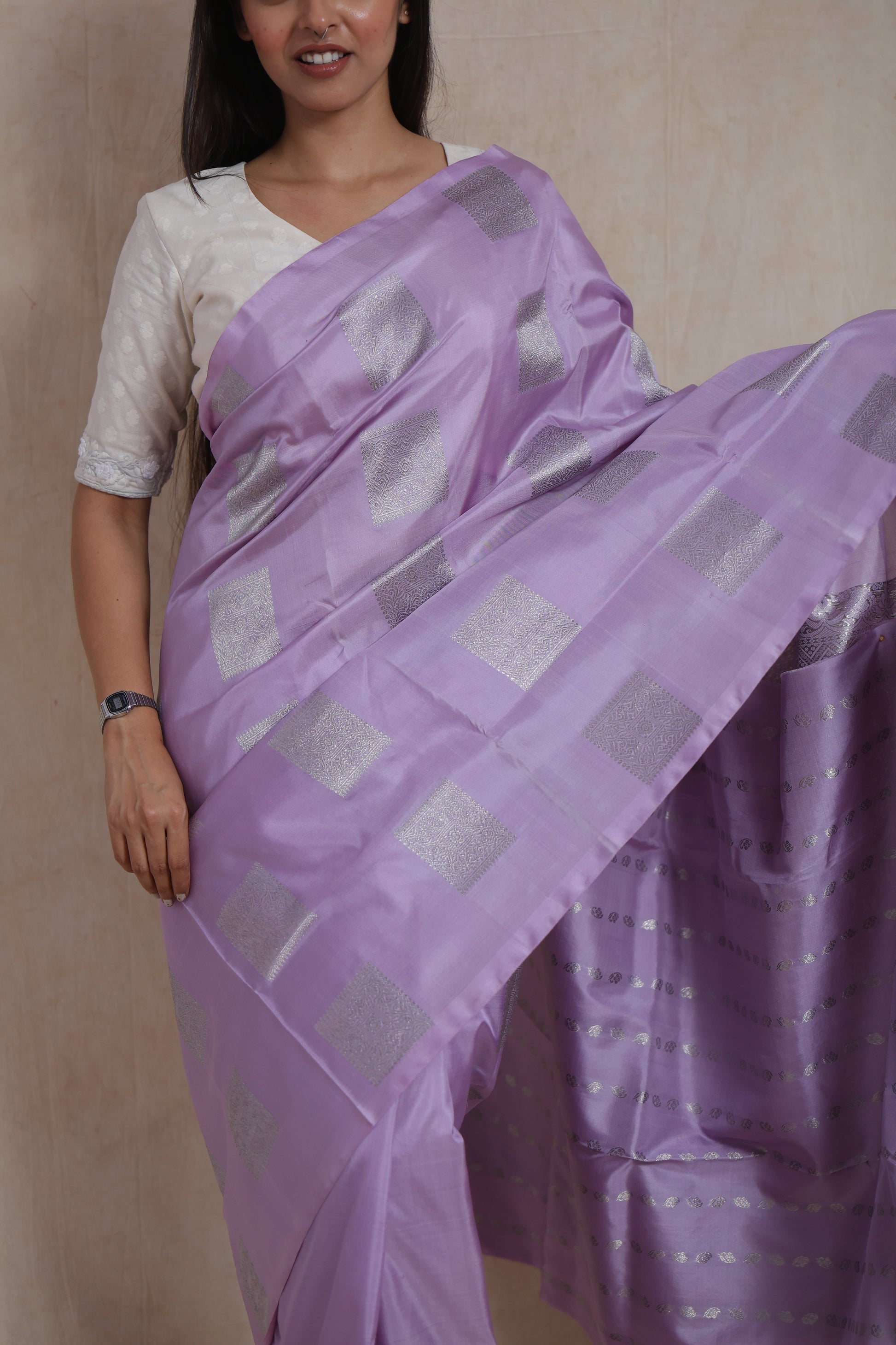 Close-up of lavender Venkatgiri silk saree with silver zari buttas