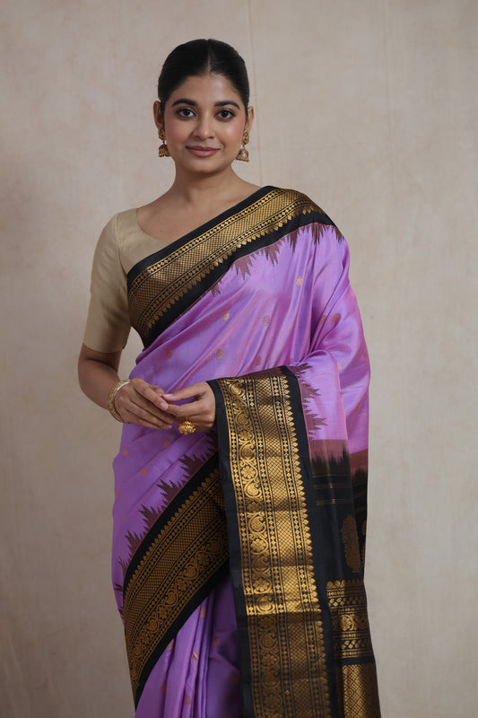 Portrait view of lavender purple Gadwal silk saree with traditional zari weaving