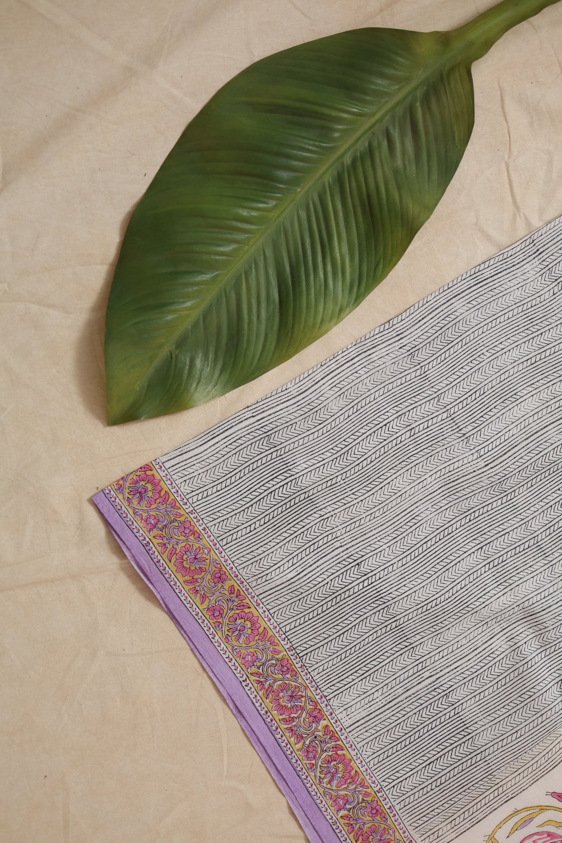 Close-up view of lilac floral Sanghnaree cotton saree with intricate print