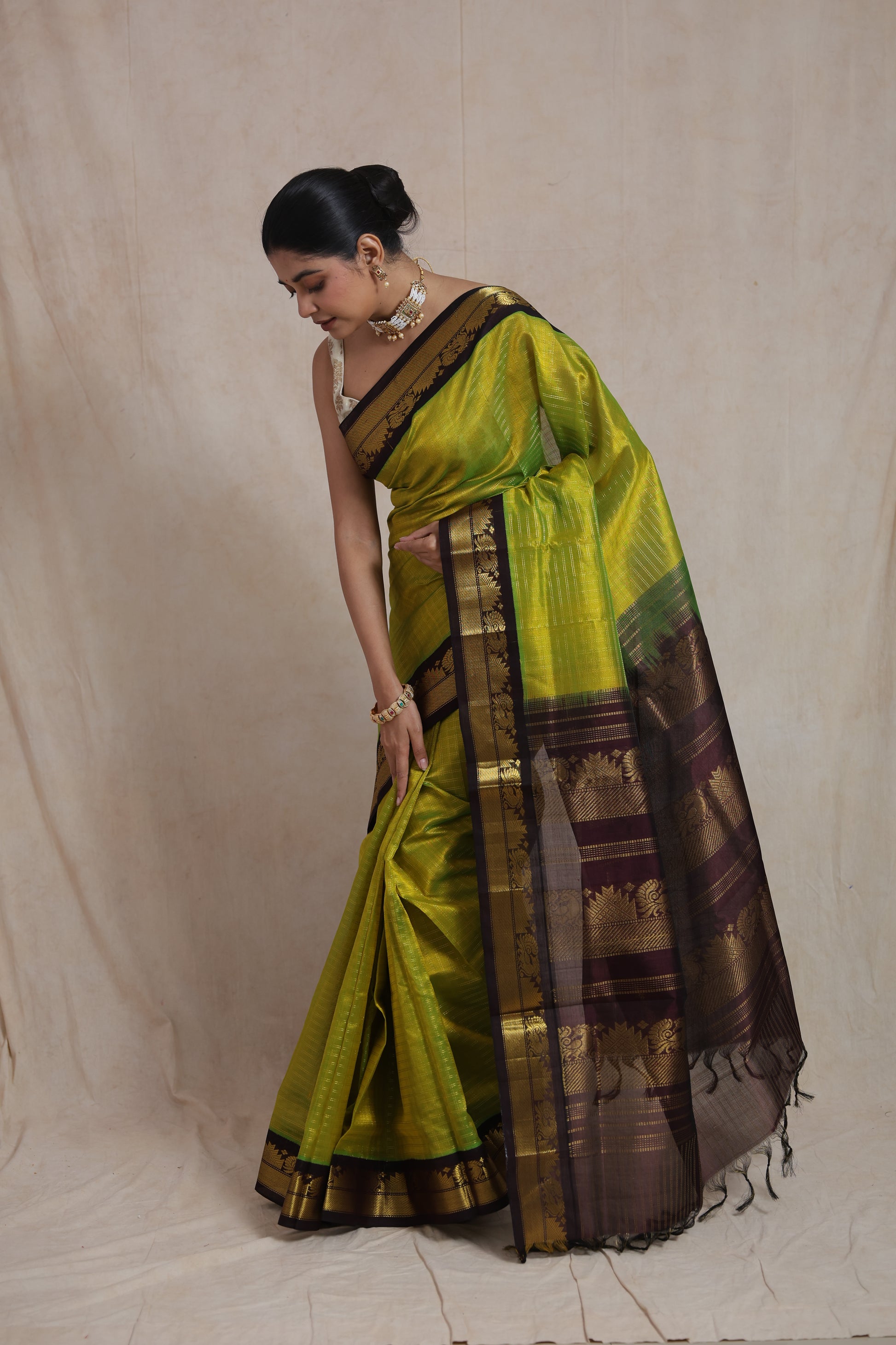 Elegant drape of lime green Kanchipuram Sico saree