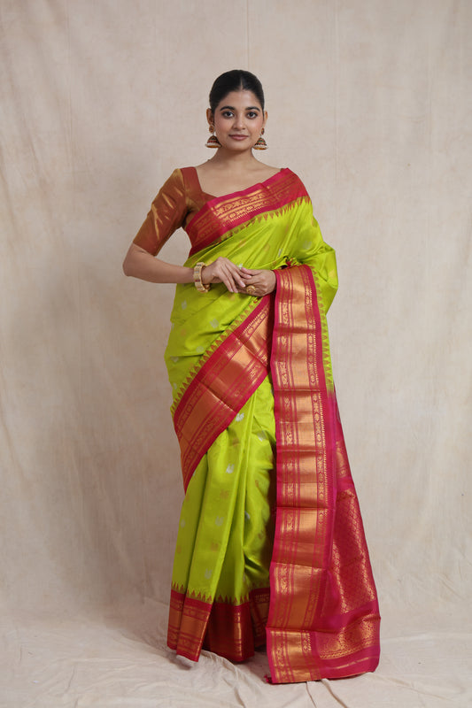 Front drape view of lime green Gadwal silk saree with woven buttas
