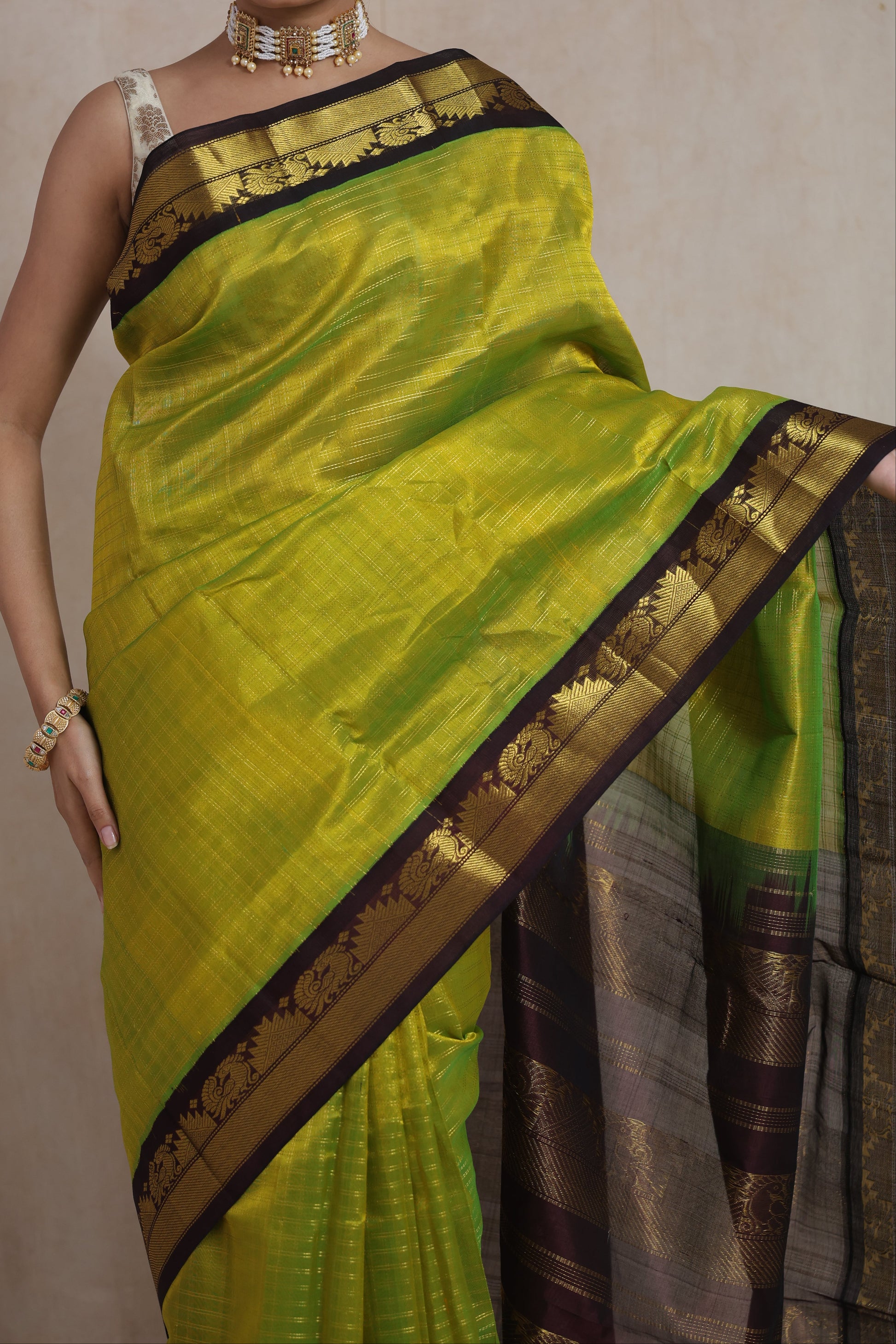 Close-up of lime green Kanchipuram Sico saree with contrast border
