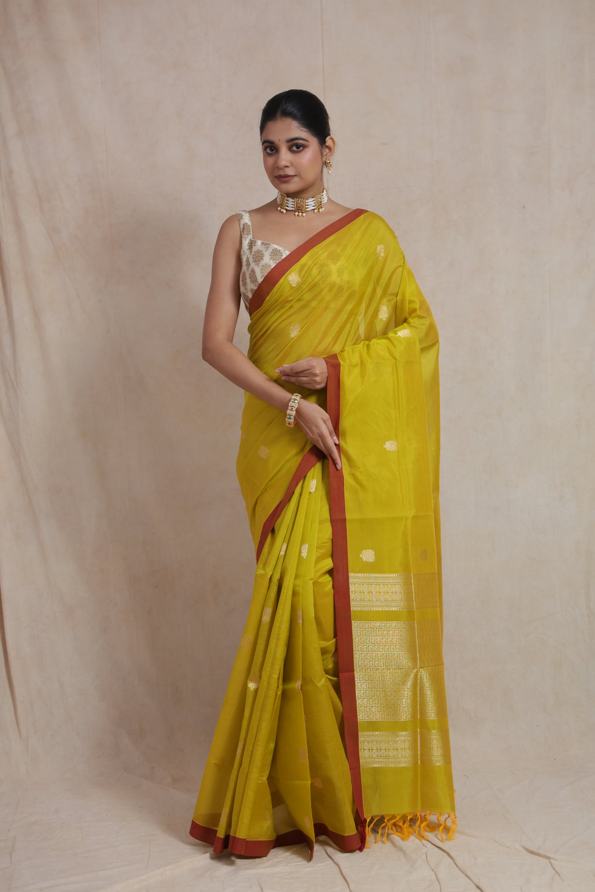 Front view of lime yellow Kanchipuram Sico saree with elegant zari detailing