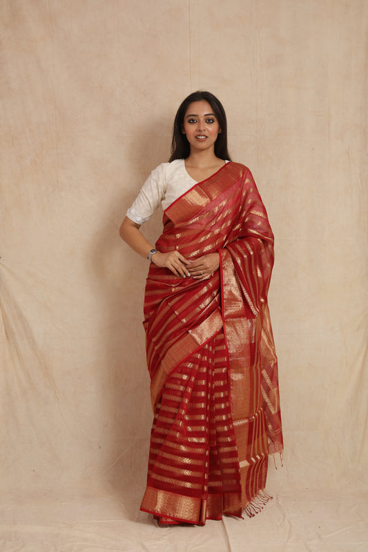 Full-length view of red Maheshwari silk tissue saree with zari woven border