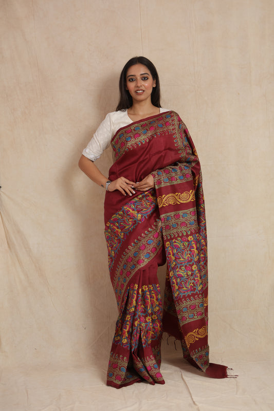 Front drape view of deep maroon Batik silk saree with artistic printed pallu