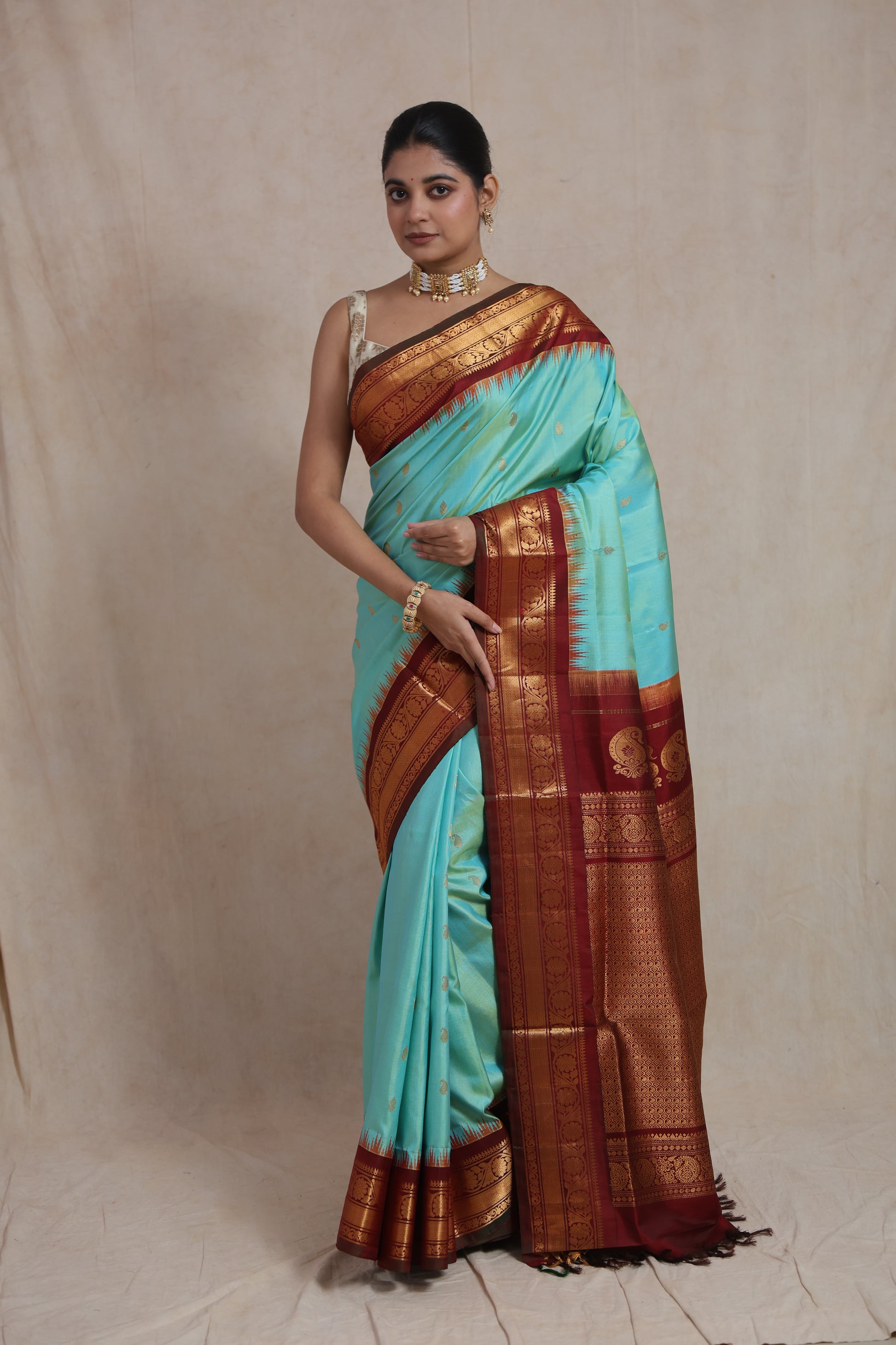 Mint green Gadwal silk saree with rich maroon zari woven pallu