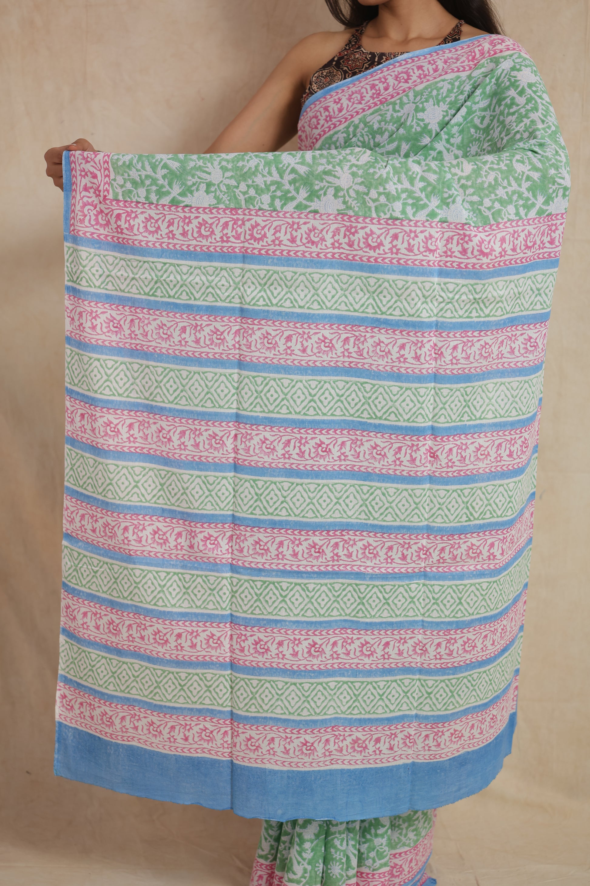 Open pallu presentation of mint green Sanghnaree cotton saree