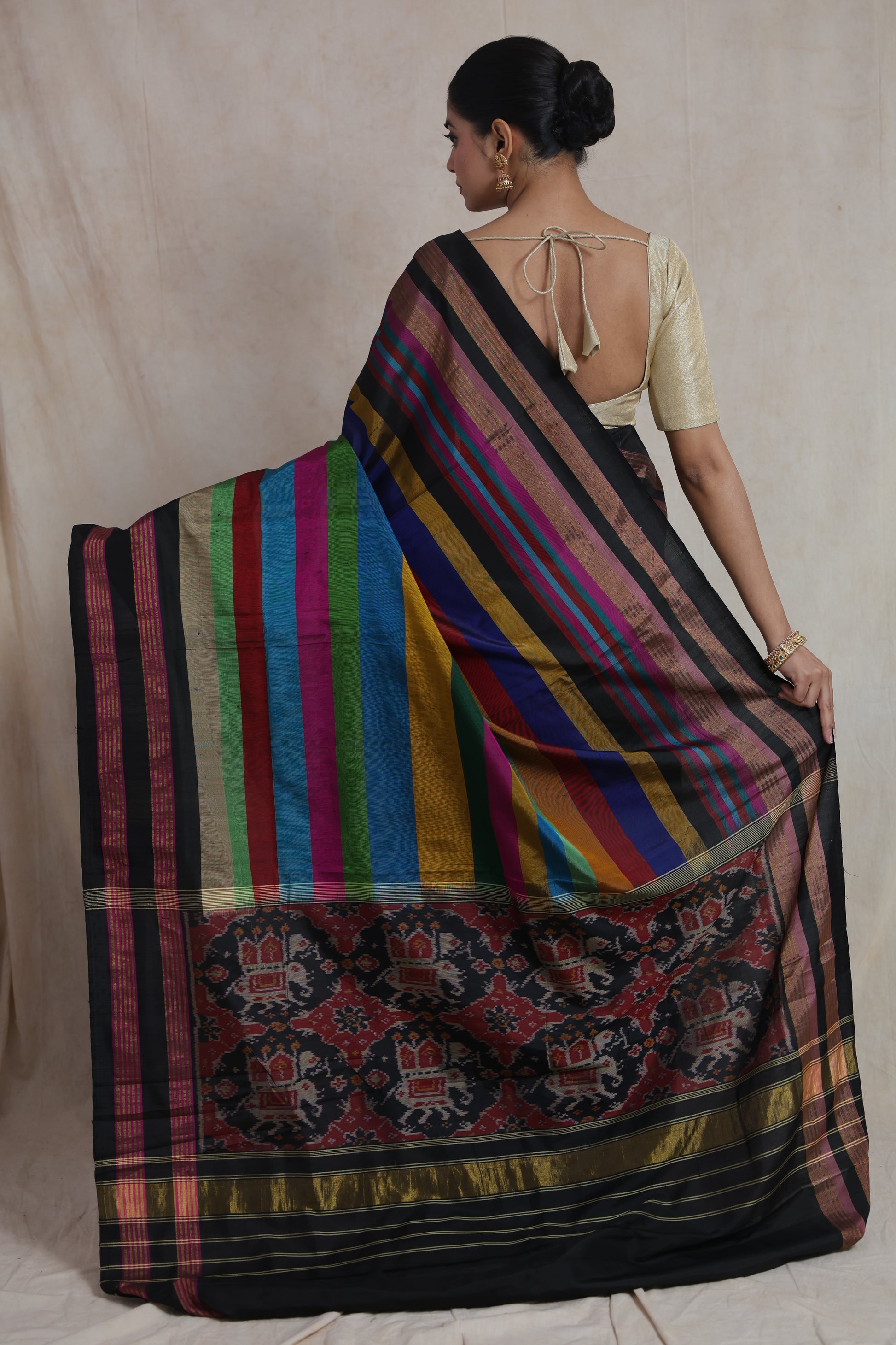 Back view of multicolor striped Patola silk saree with black woven border
