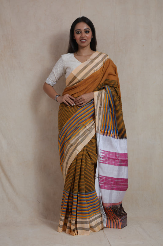 Front view of mustard brown Ilkal handloom cotton saree with multicolor striped pallu and traditional border