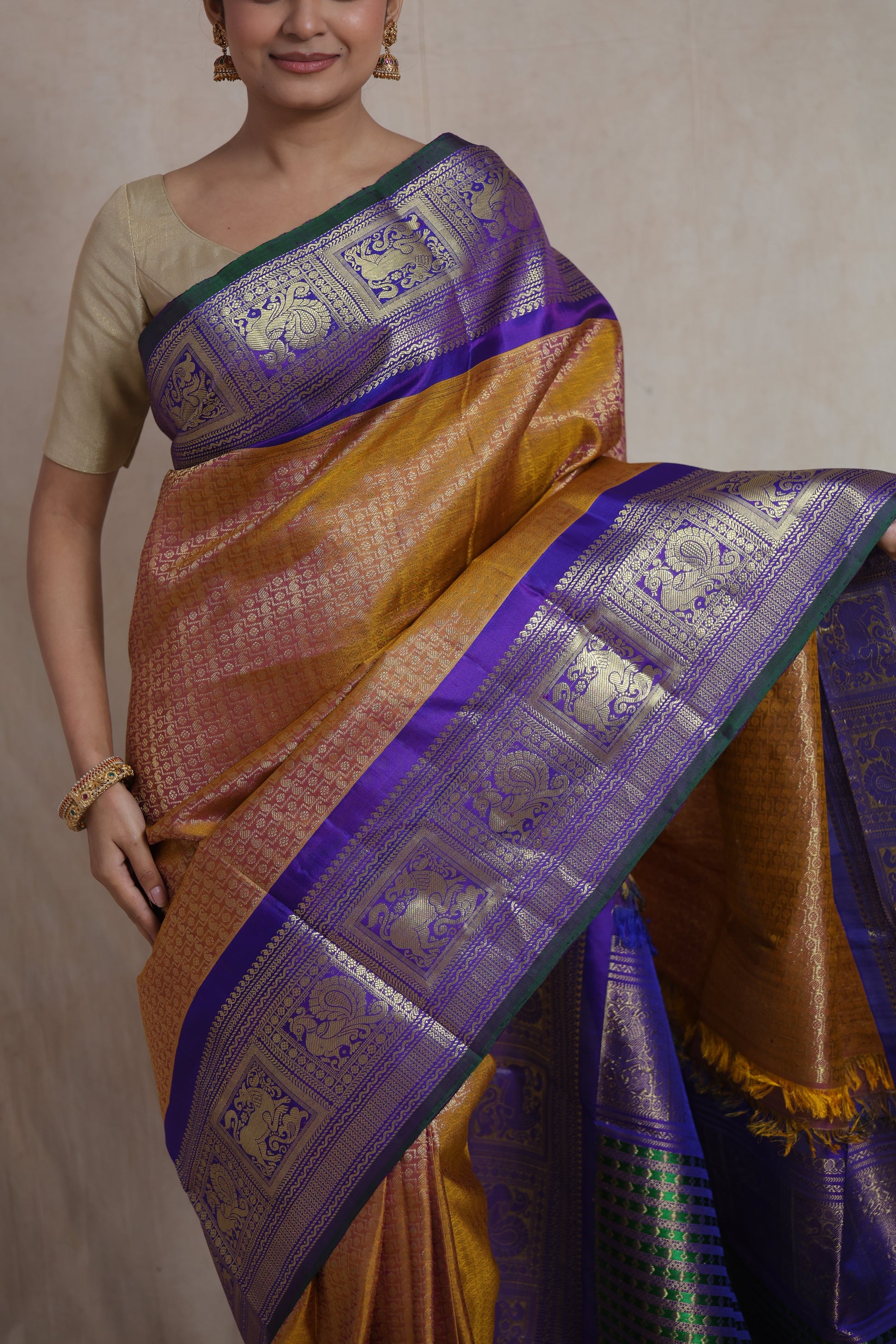 Detailed border view of mustard gold Gadwal Silk saree with intricate zari weaving