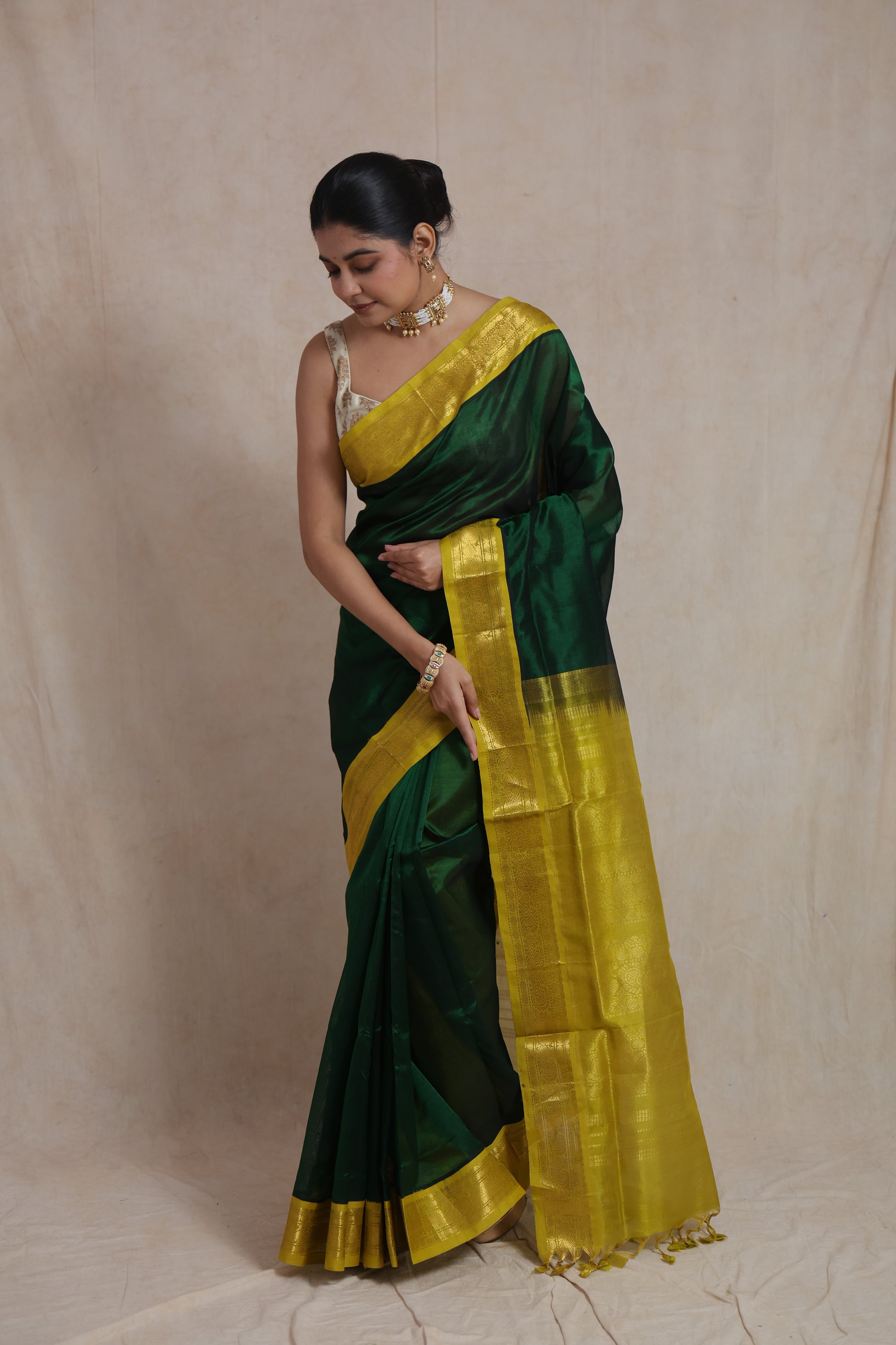 Detailed zari woven border of green Kanchipuram silk cotton saree