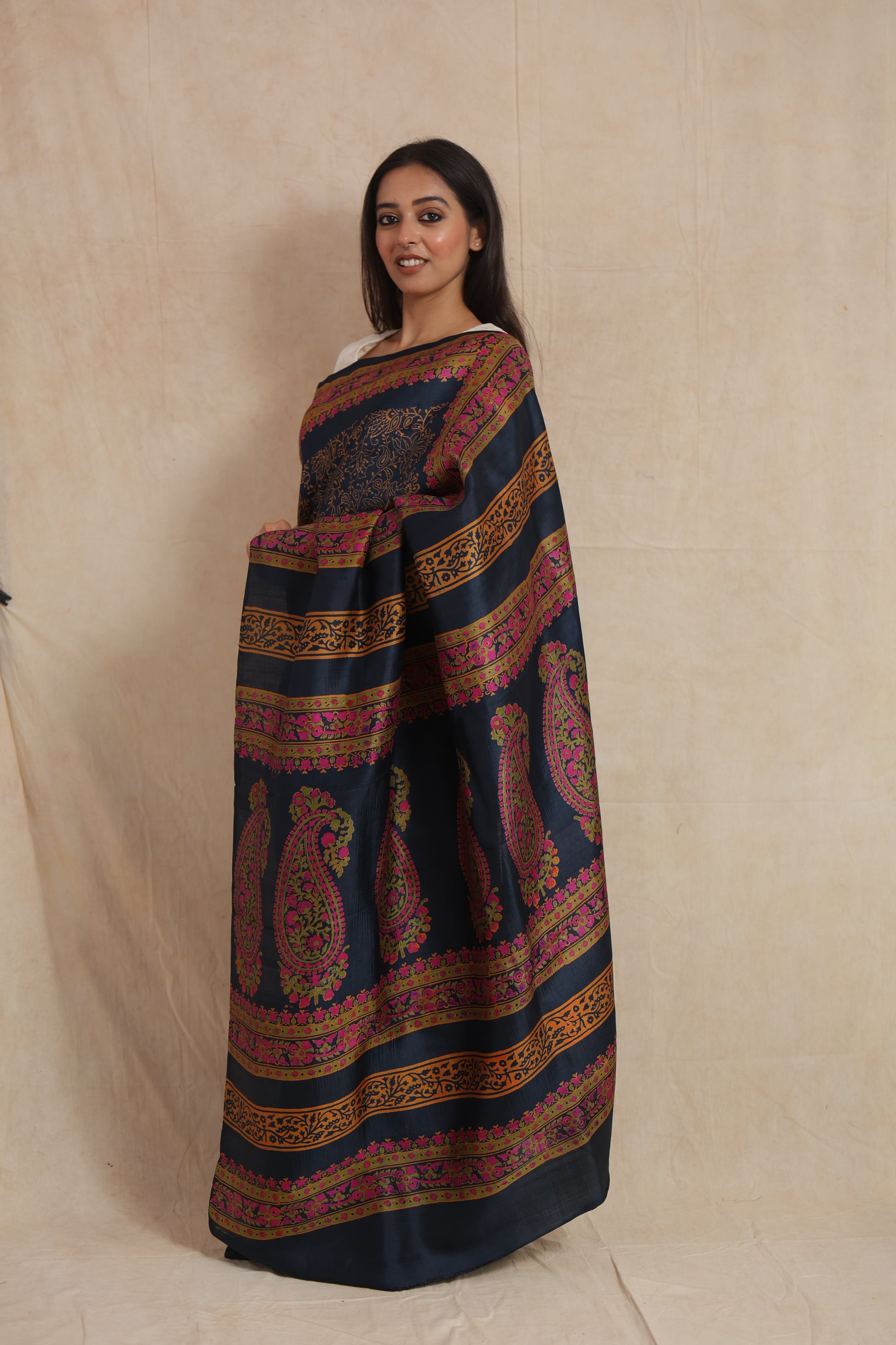 Side profile of navy blue Batik silk saree with artistic printed pallu