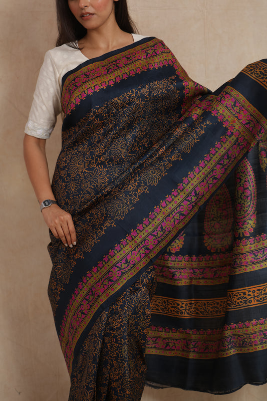 Close-up of navy blue Batik silk saree with floral vine print and border