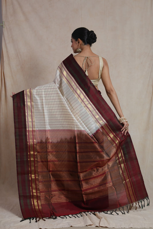 Back view of off white Kanchipuram silk cotton saree with maroon zari pallu