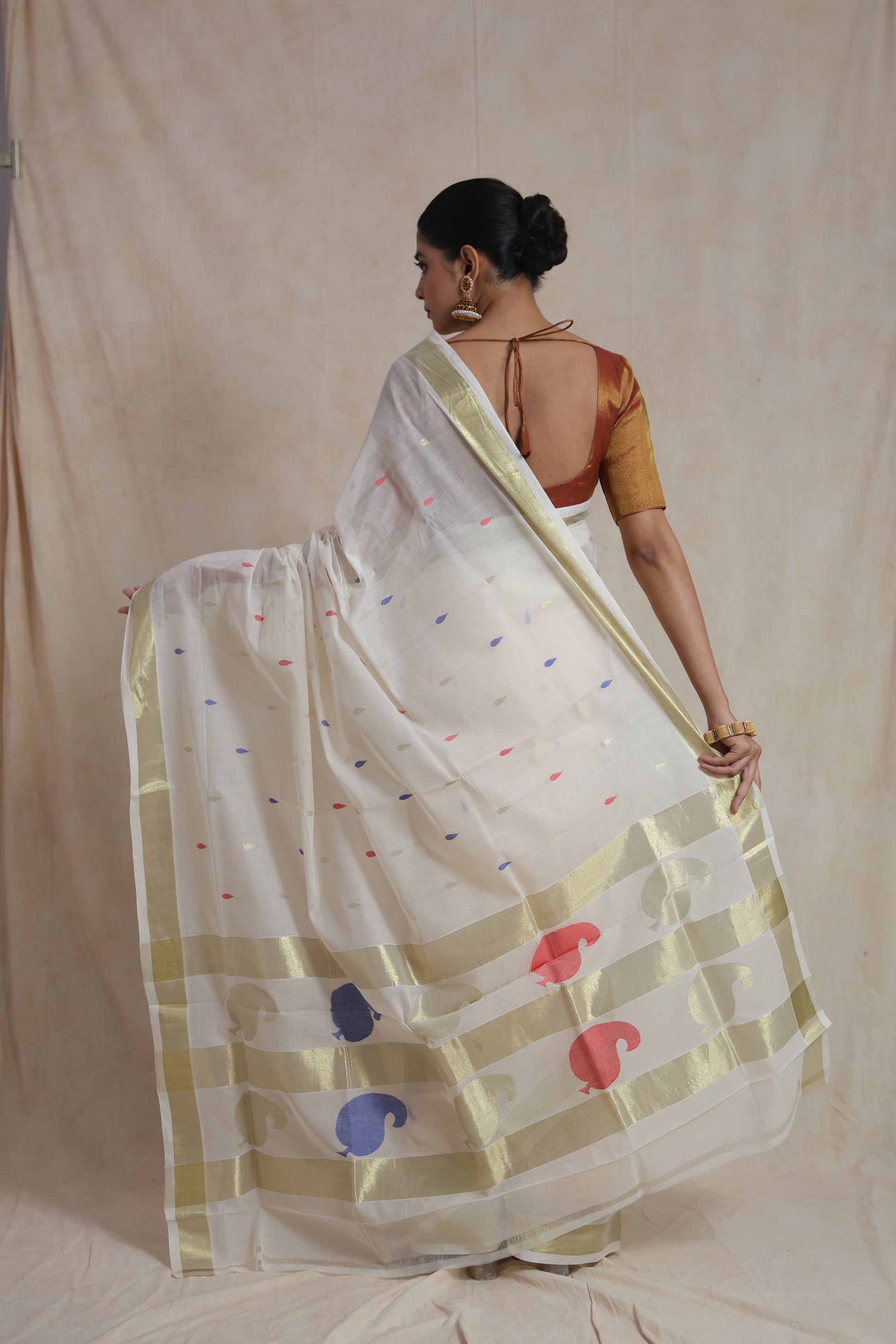Off white Kanchipuram cotton saree with artistic woven pallu