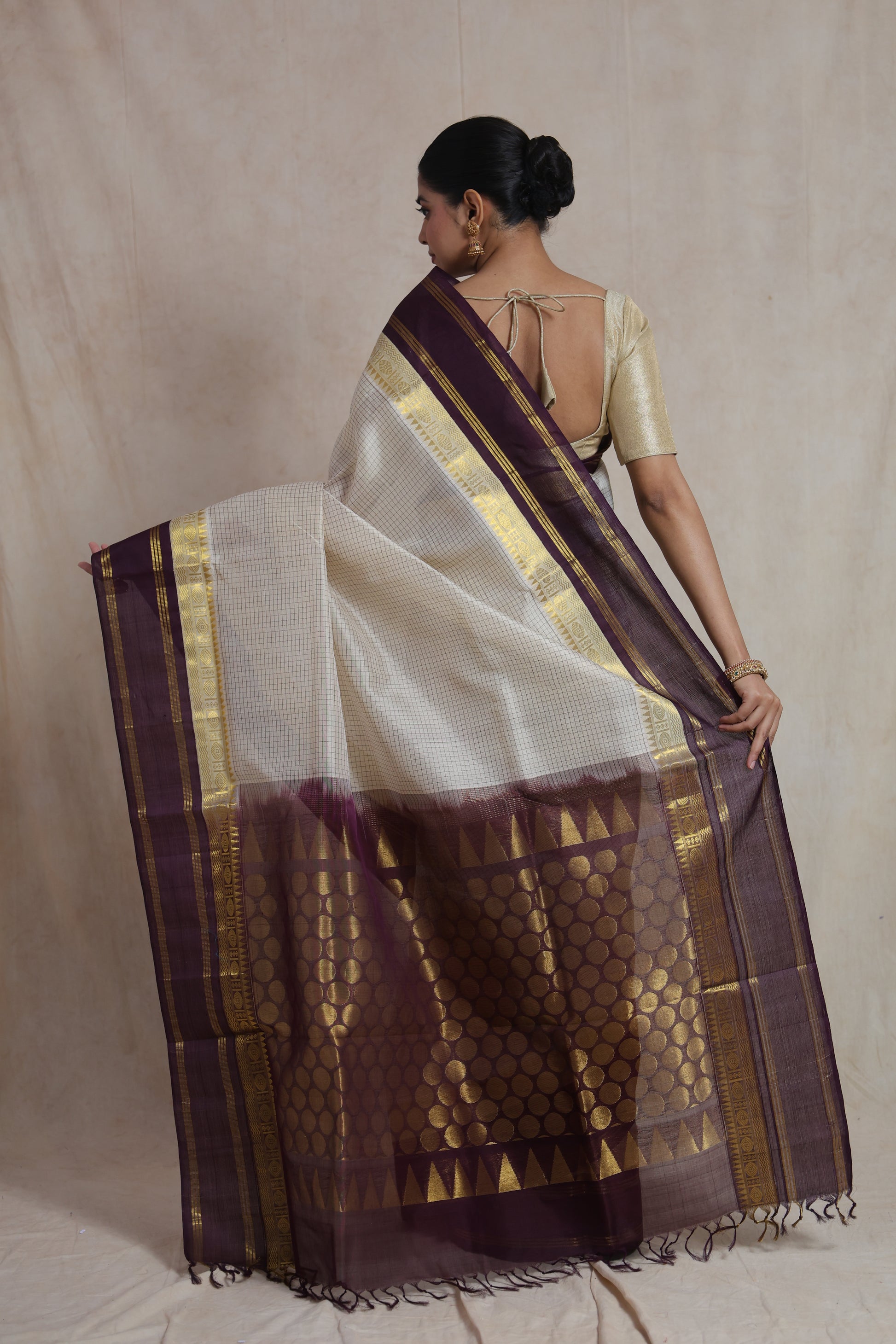 Back view of off white Kanchipuram Sico saree with purple zari woven pallu