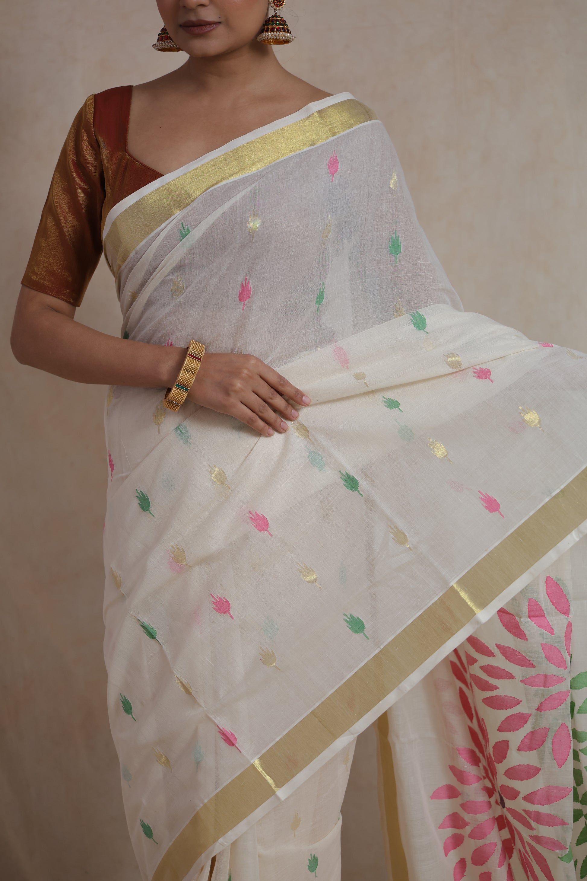 Elegant off white cotton saree with classic golden zari border