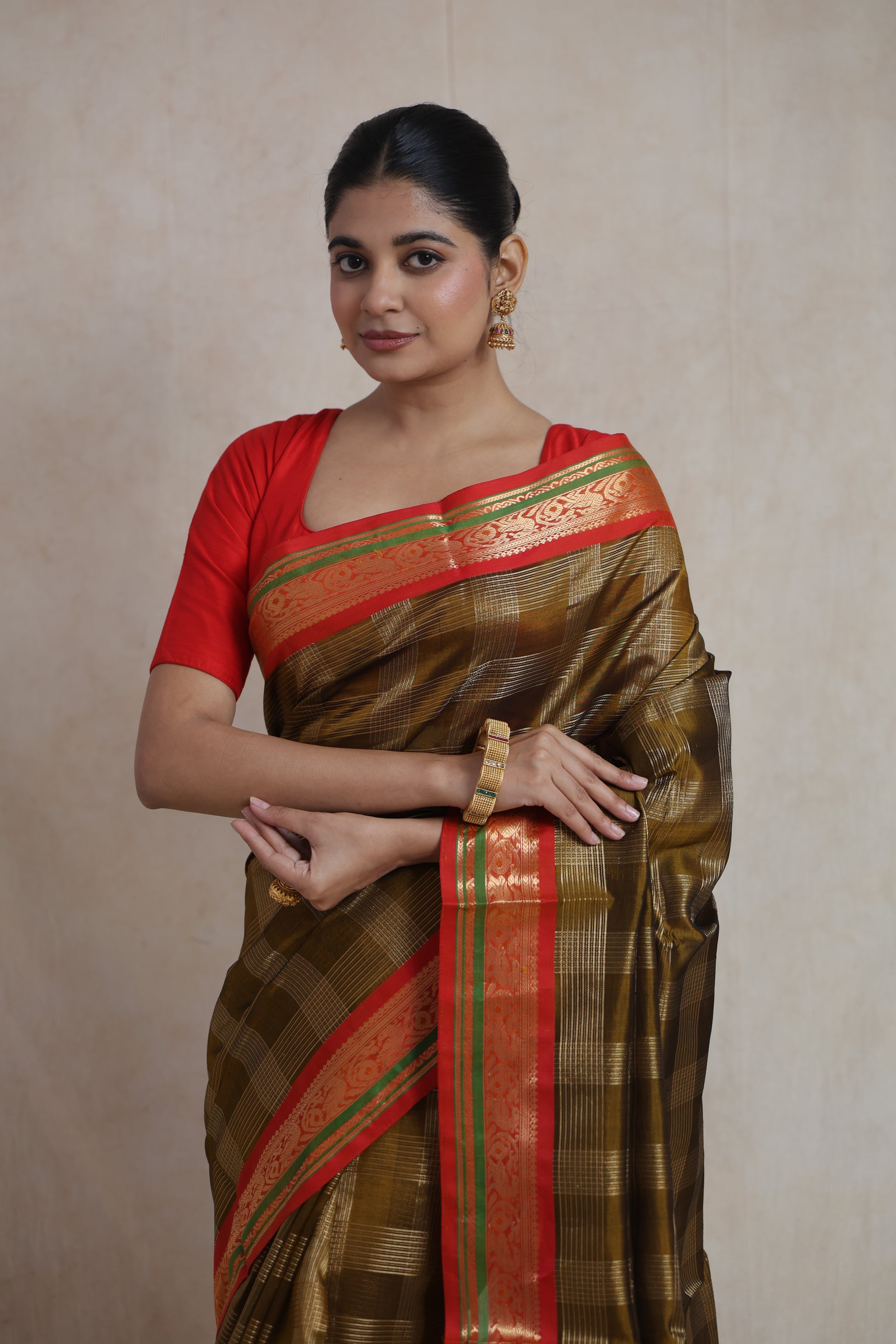 Front drape view of olive gold Kanchipuram silk cotton saree