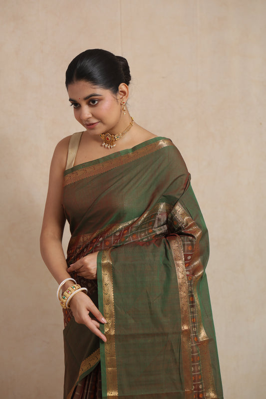 Portrait view of olive green Kanchipuram cotton saree with elegant traditional detailing