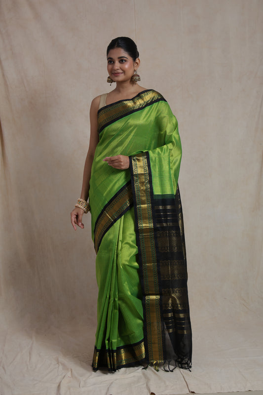 Parrot green Kanchipuram silk cotton saree with black zari border