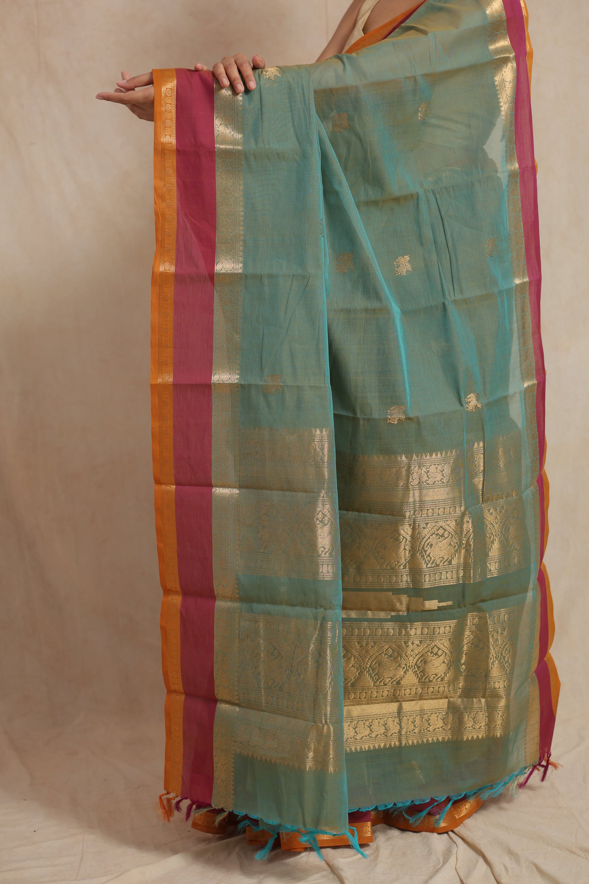 Close-up of woven pallu on pastel aqua green Kanchipuram cotton saree
