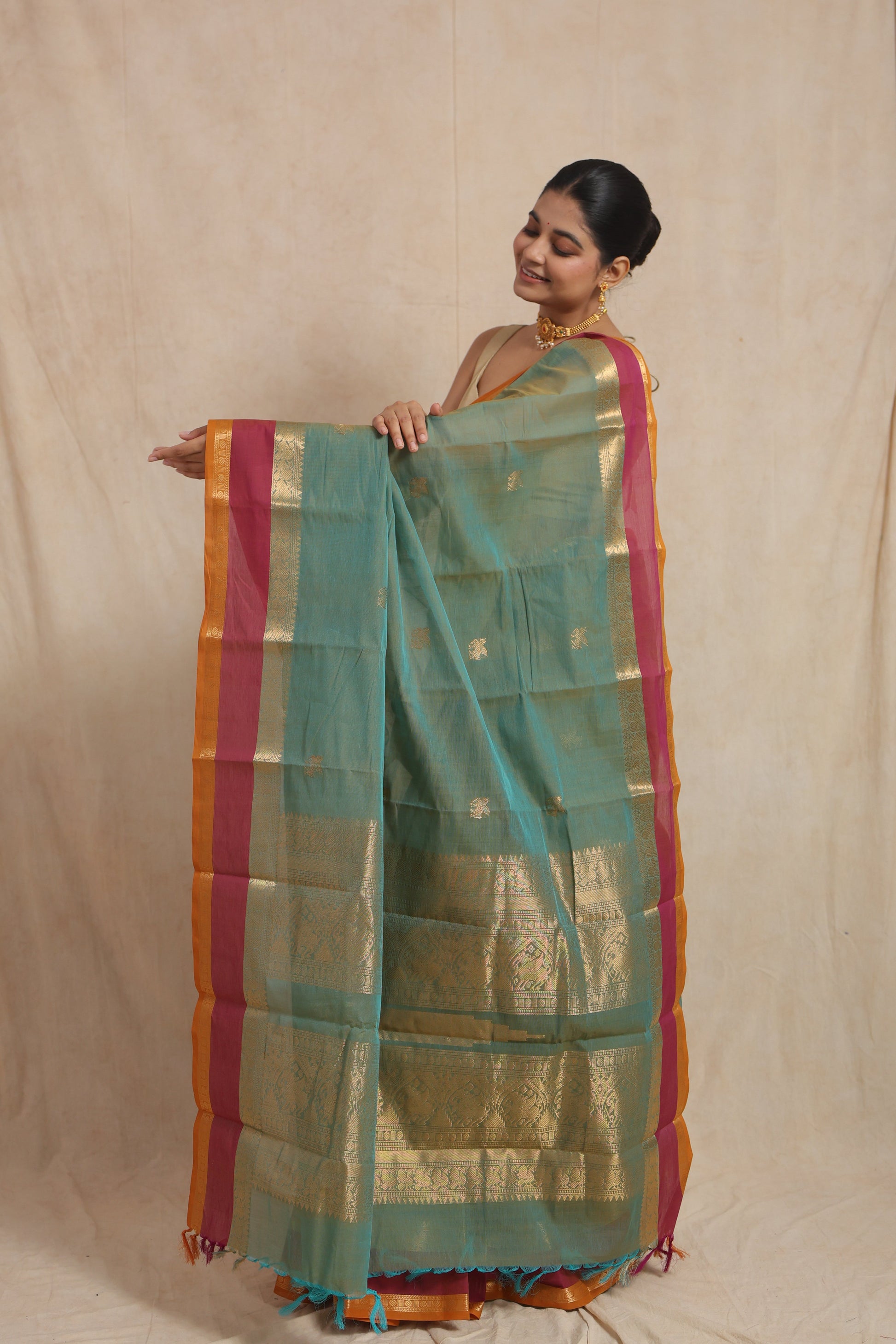 Pallu display of pastel aqua green Kanchipuram cotton saree