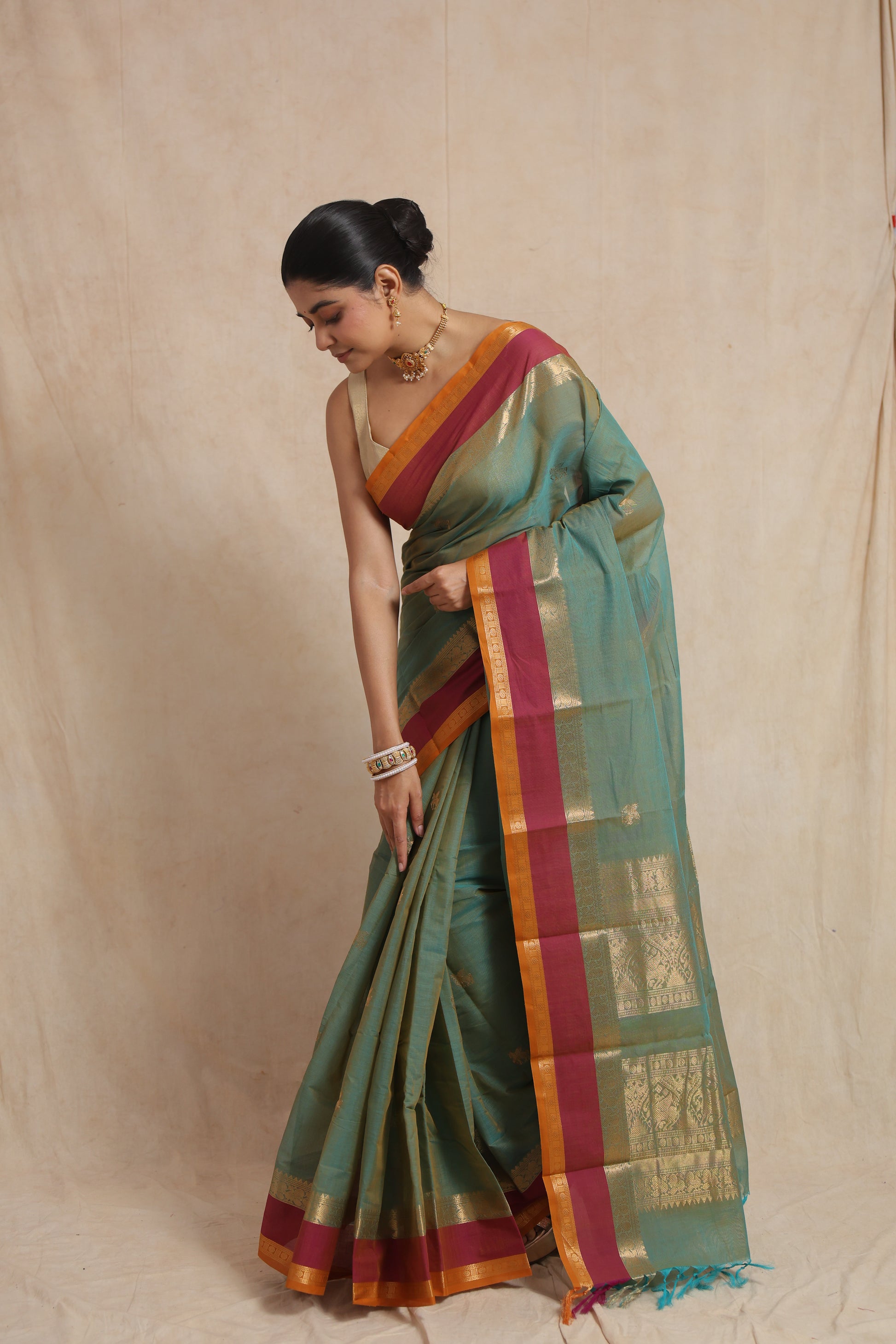 Side drape view of pastel aqua green Kanchipuram cotton saree