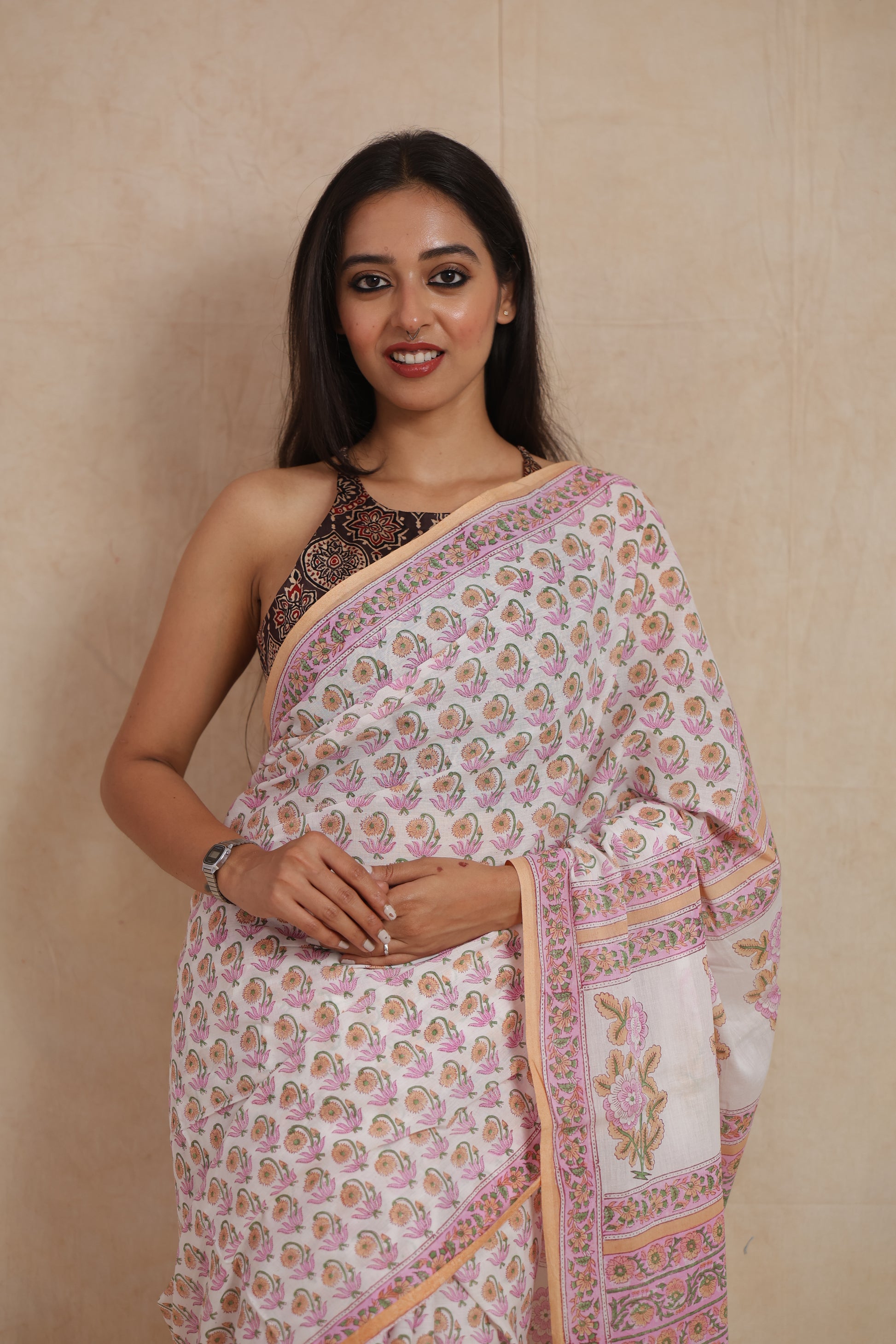 Front view of pastel pink floral Sanganeri cotton saree