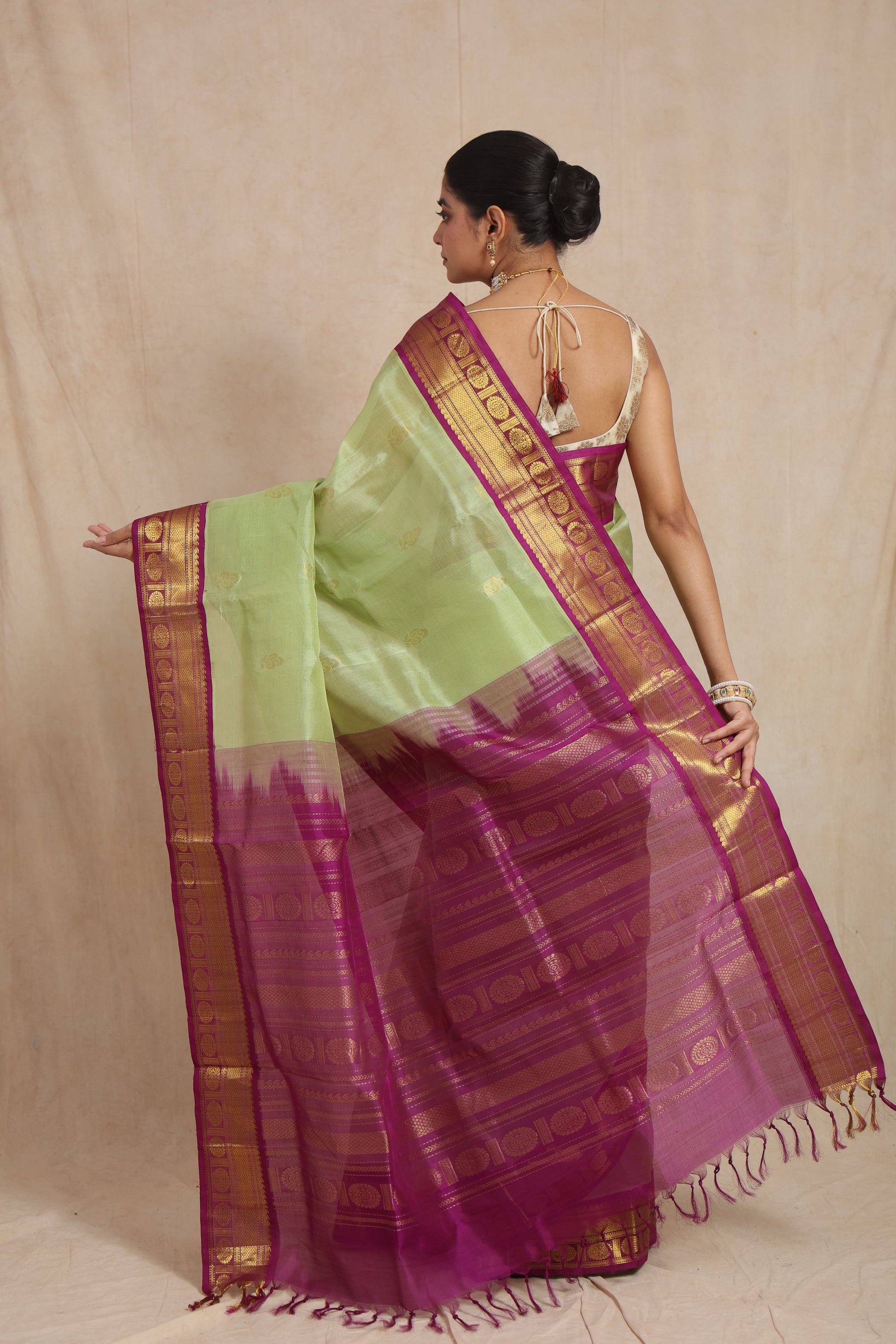 Back view of pastel green Kanchipuram Sico saree with magenta zari pallu