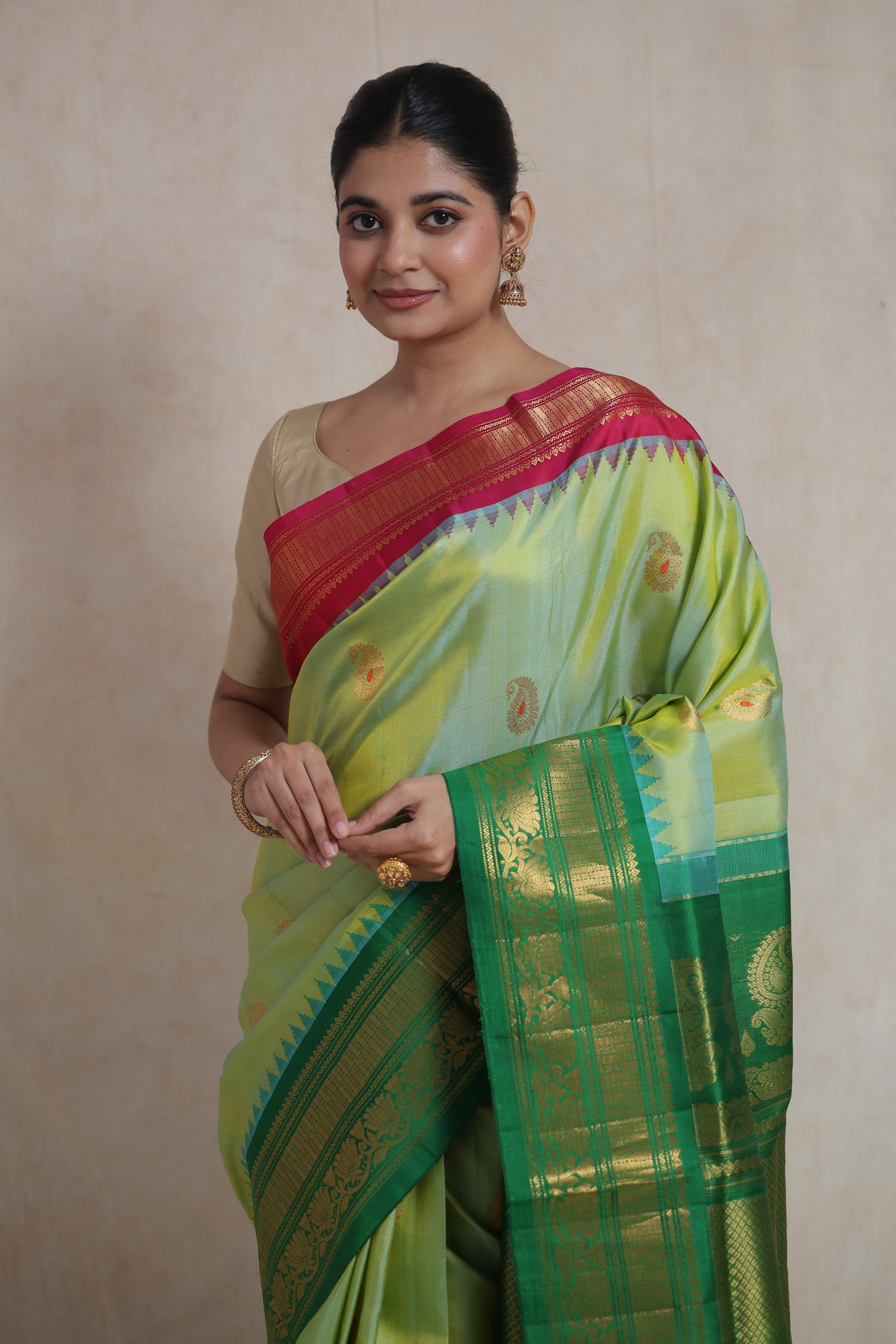 Close-up of pastel lime green Gadwal Sico saree with woven buttas