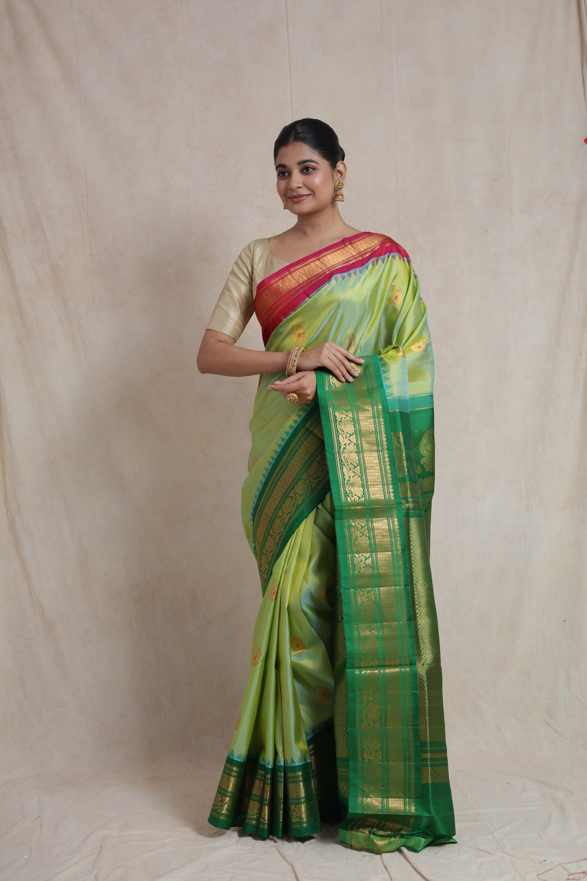 Portrait styling of lime green Gadwal Sico saree with woven motifs